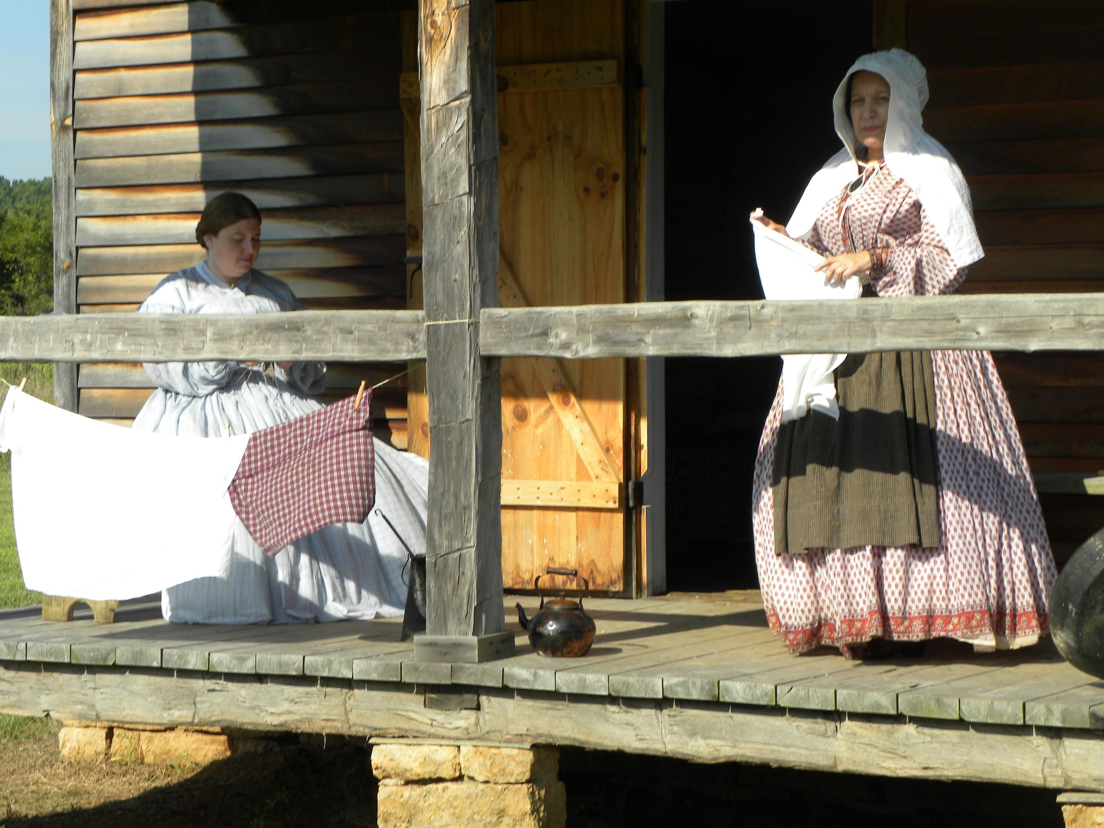 Living history volunteers give demonstration at the historic Edwards Cabin