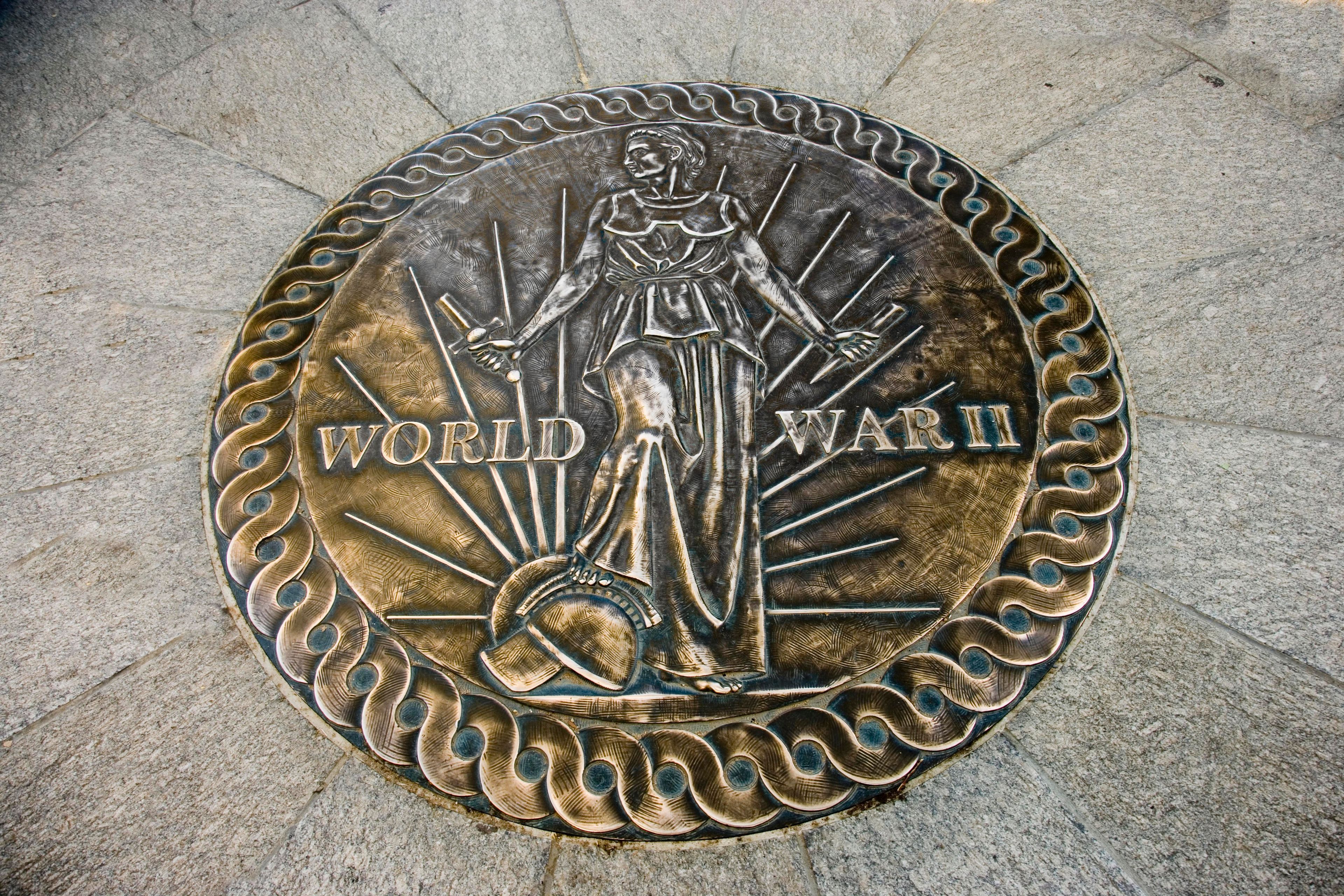 One of the two plaques showing a nation answering the call to defend freedom