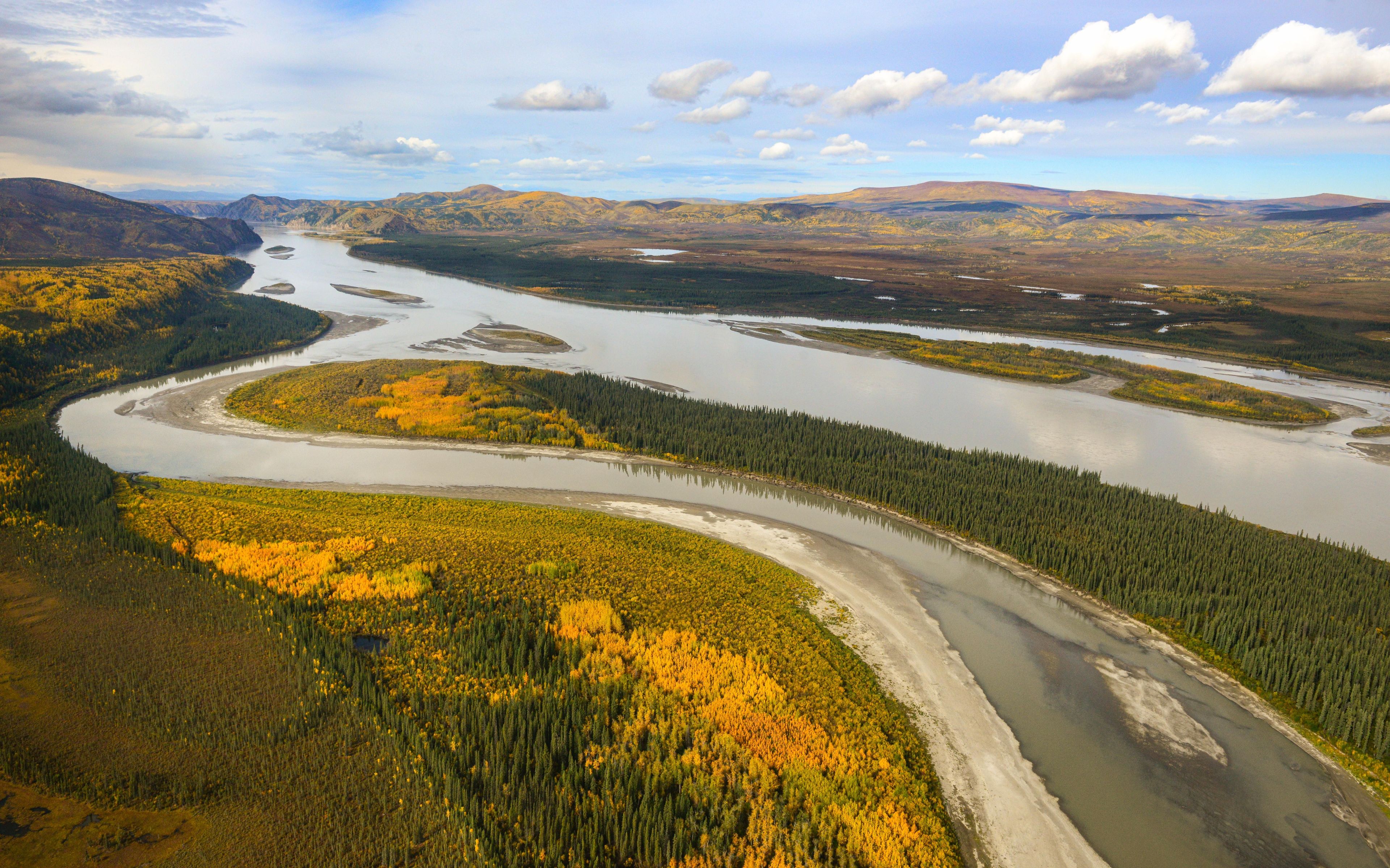 The Yukon River is a vast body of water that has carved its path into the landscape over millions of years.