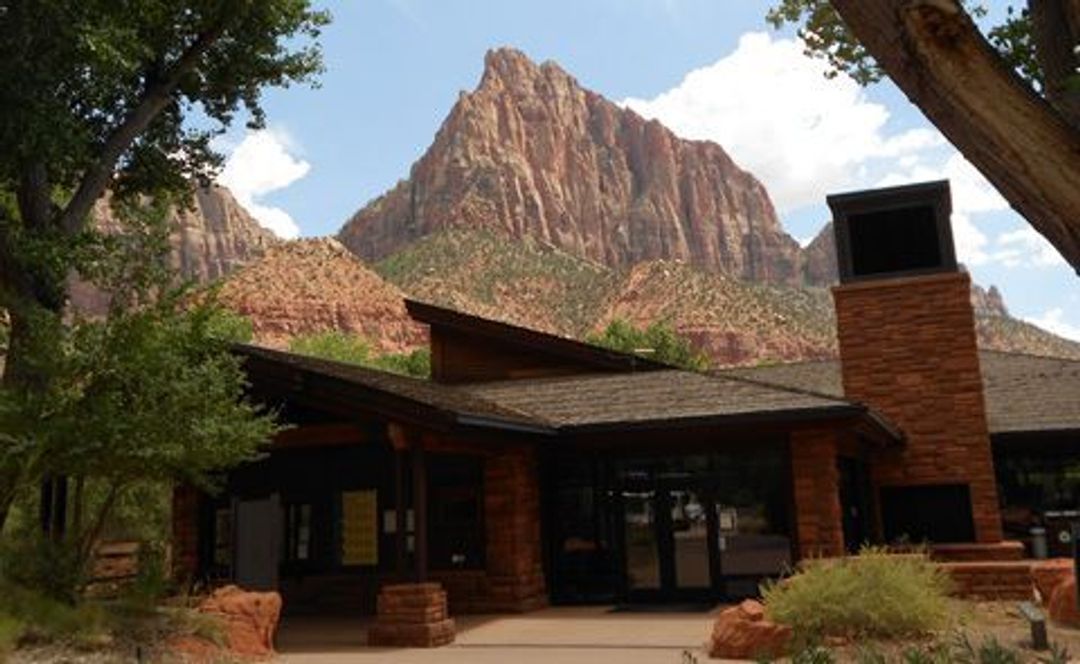 The Zion Canyon Visitor Center sits near the sandstone peak known as the Watchman