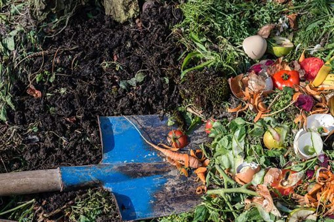 Composting visual of shovel and biodegradable waste