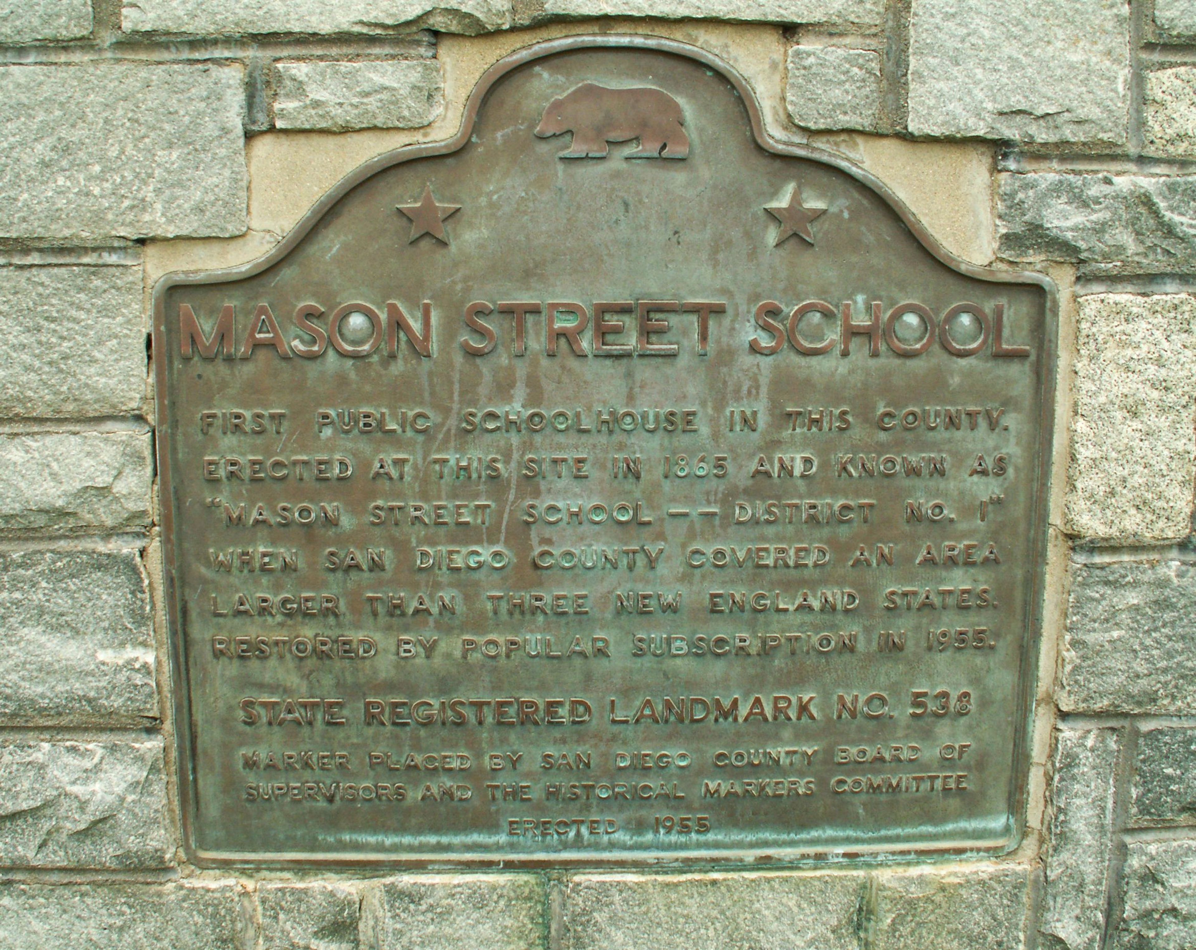 Photo of a plaque for the Mason Street School (previous name of the Schoolhouse), located near the Schoolhouse building