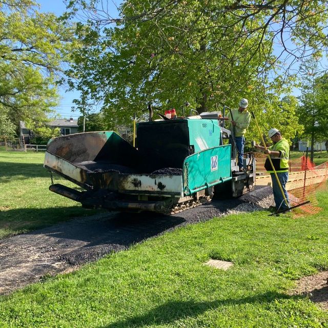 Photo of asphalt laying machine on the trail at Bryan Park.