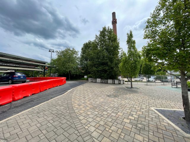 A cordoned-off detour, lined with orange barricades, was installed on the B-Line Trail around the Johnson Creamery Smokestack.