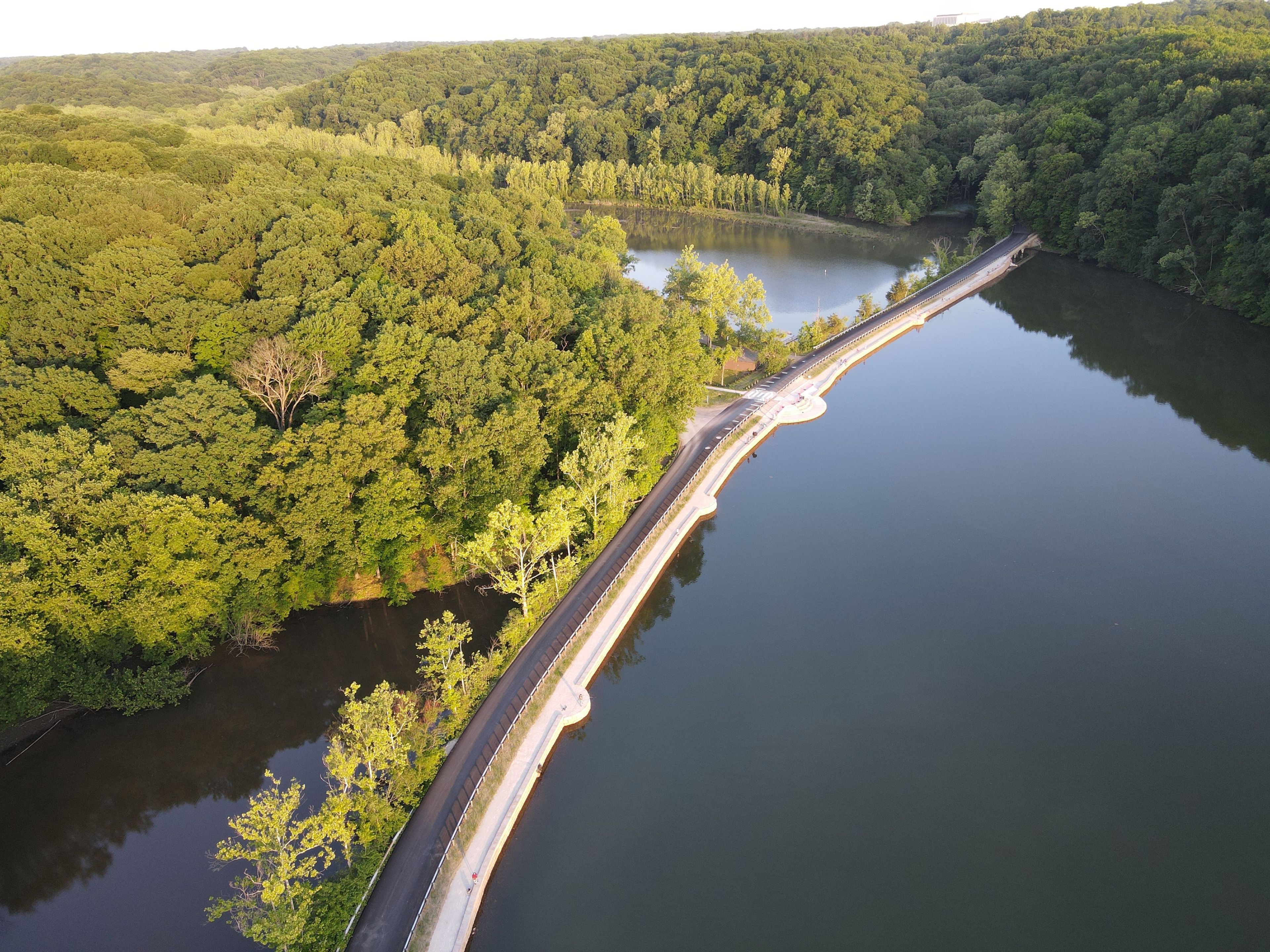 Aerial view of the Griffy Lake boathouse and newly paved causeway across the lake.