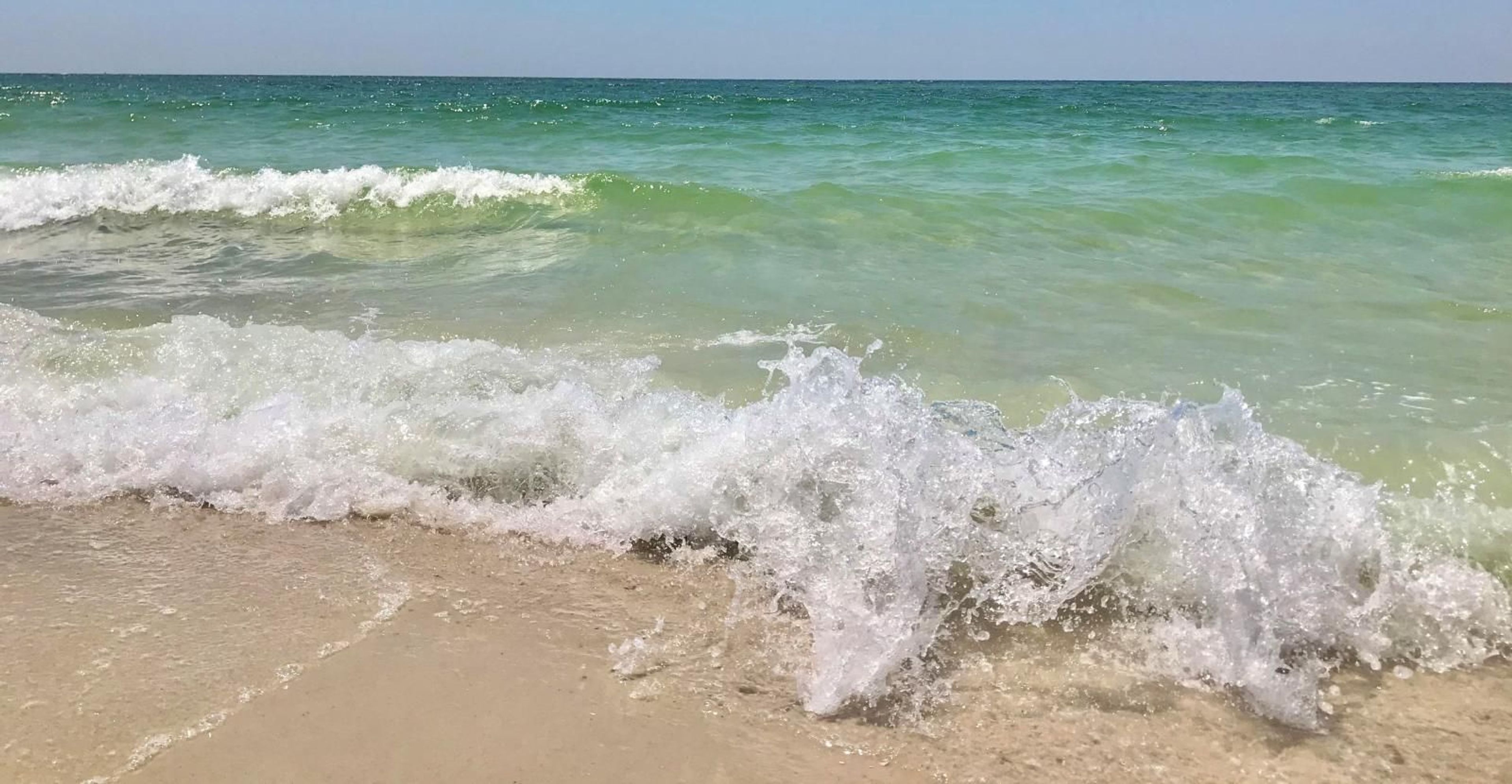 Waves crashing at the beach.