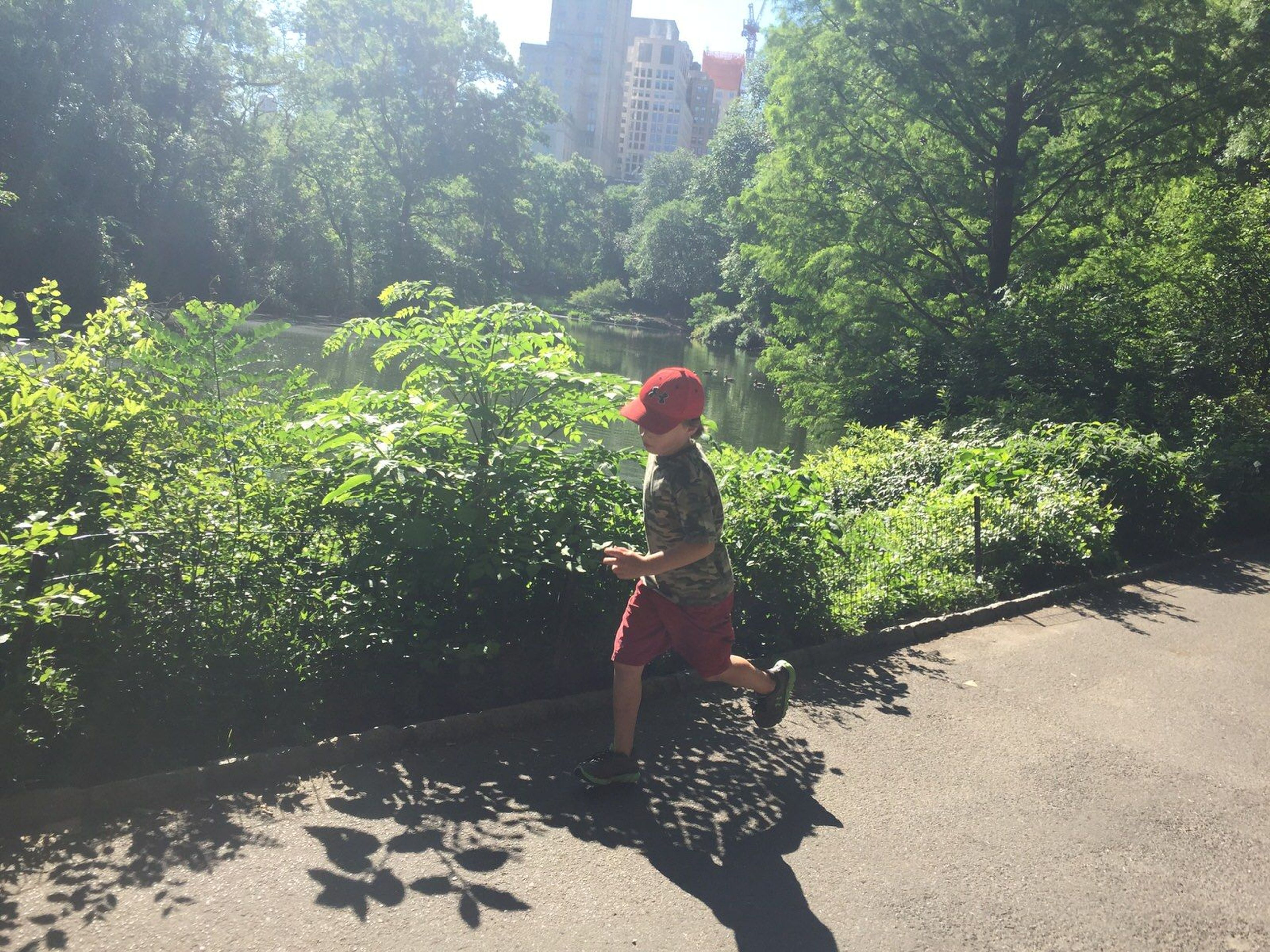 A boy runs along the trail in Central Park. Photo by Chris Sheffield.