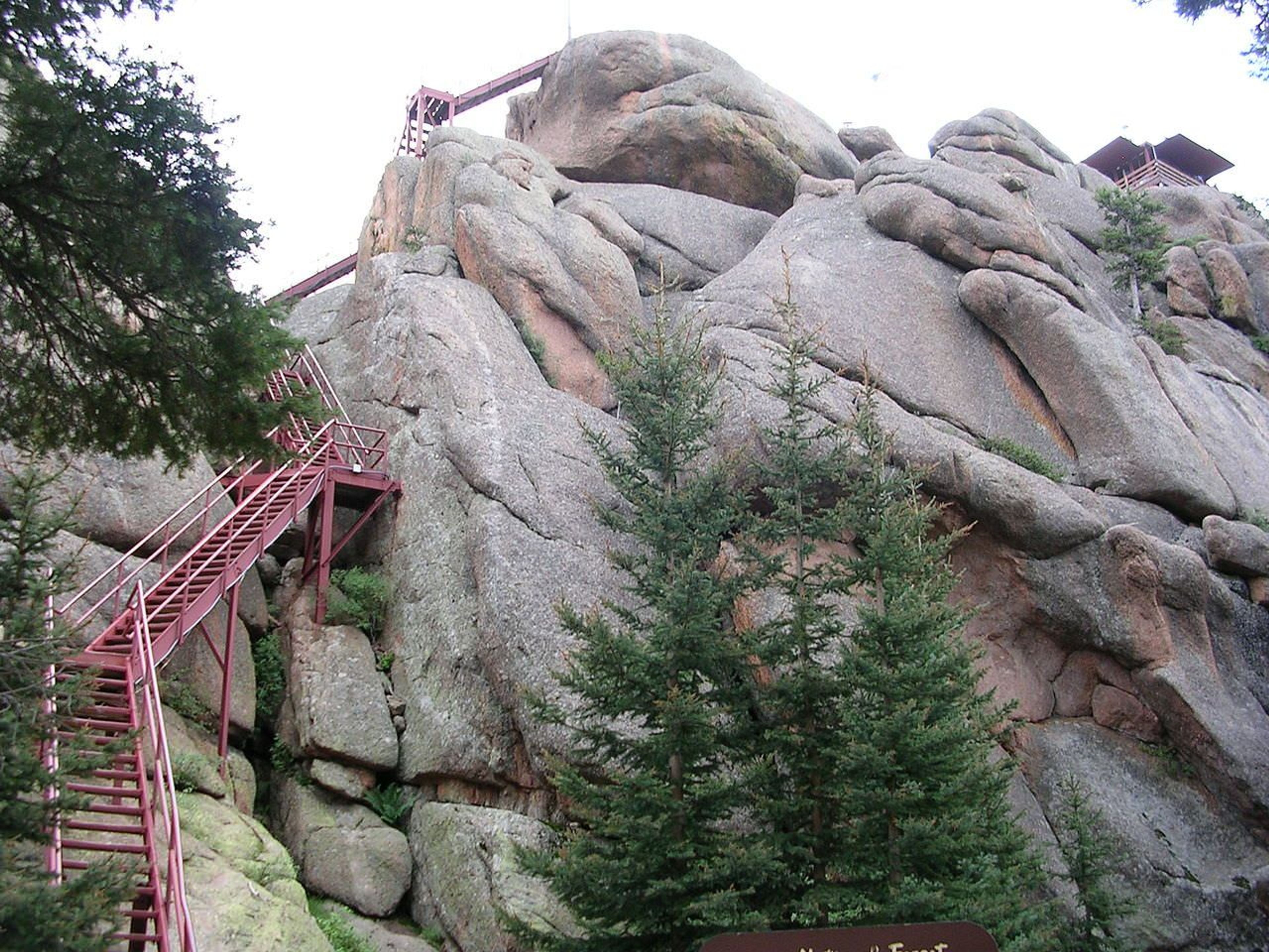 Stairs leading up to Devil's Head Lookout in Colorado. The tower is visible in the upper right corner. Photo by Glennfcowan/wiki.