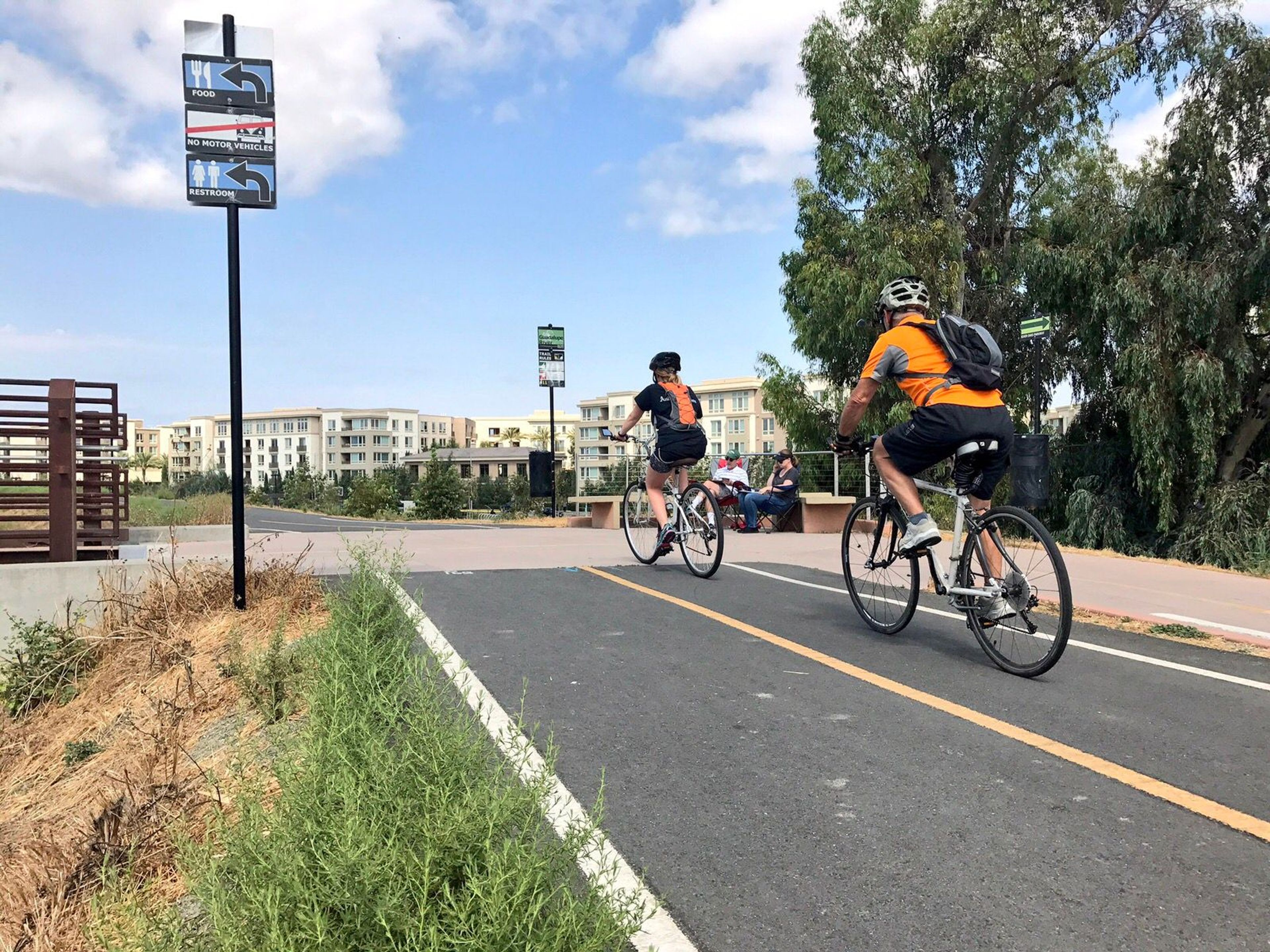 Bicyclists enjoying a sunny Wednesday through North San Jose. Photo by Yves Zsutty.