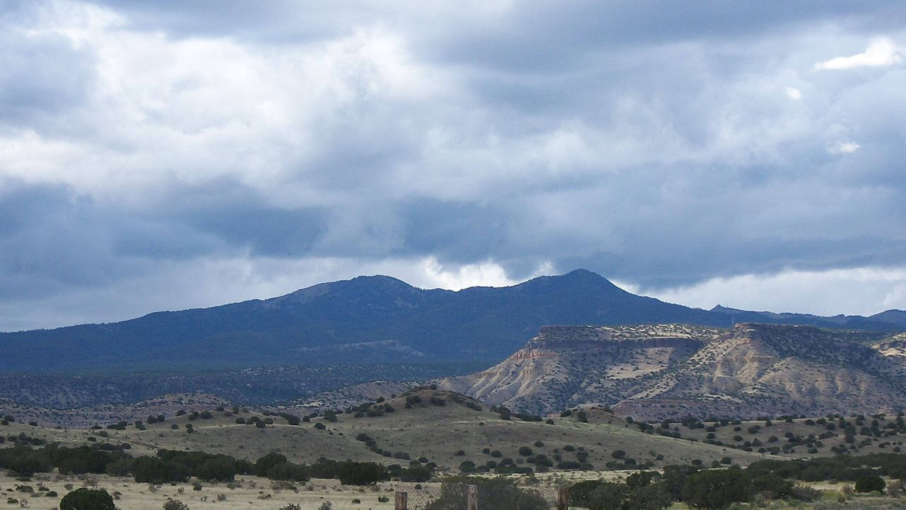 Mount Taylor as seen from the village of Encinal, New Mexico. Photo by Charles Xavier/wiki.