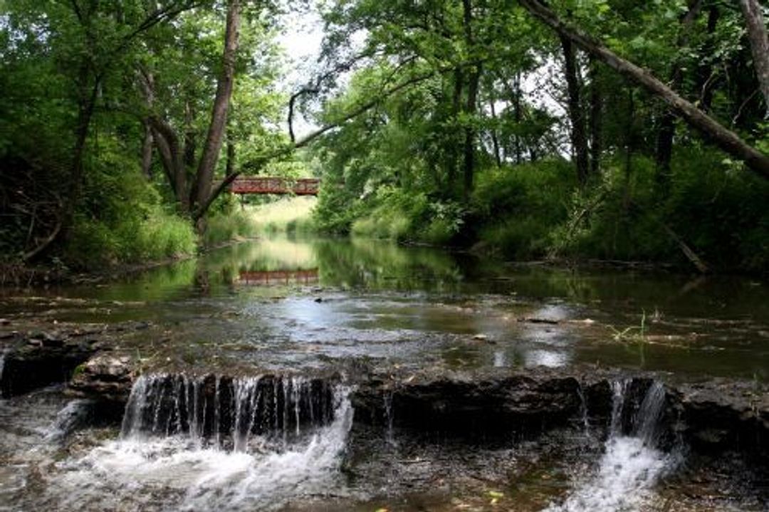 The natural rock waterfall at Prairie Creek Greenway