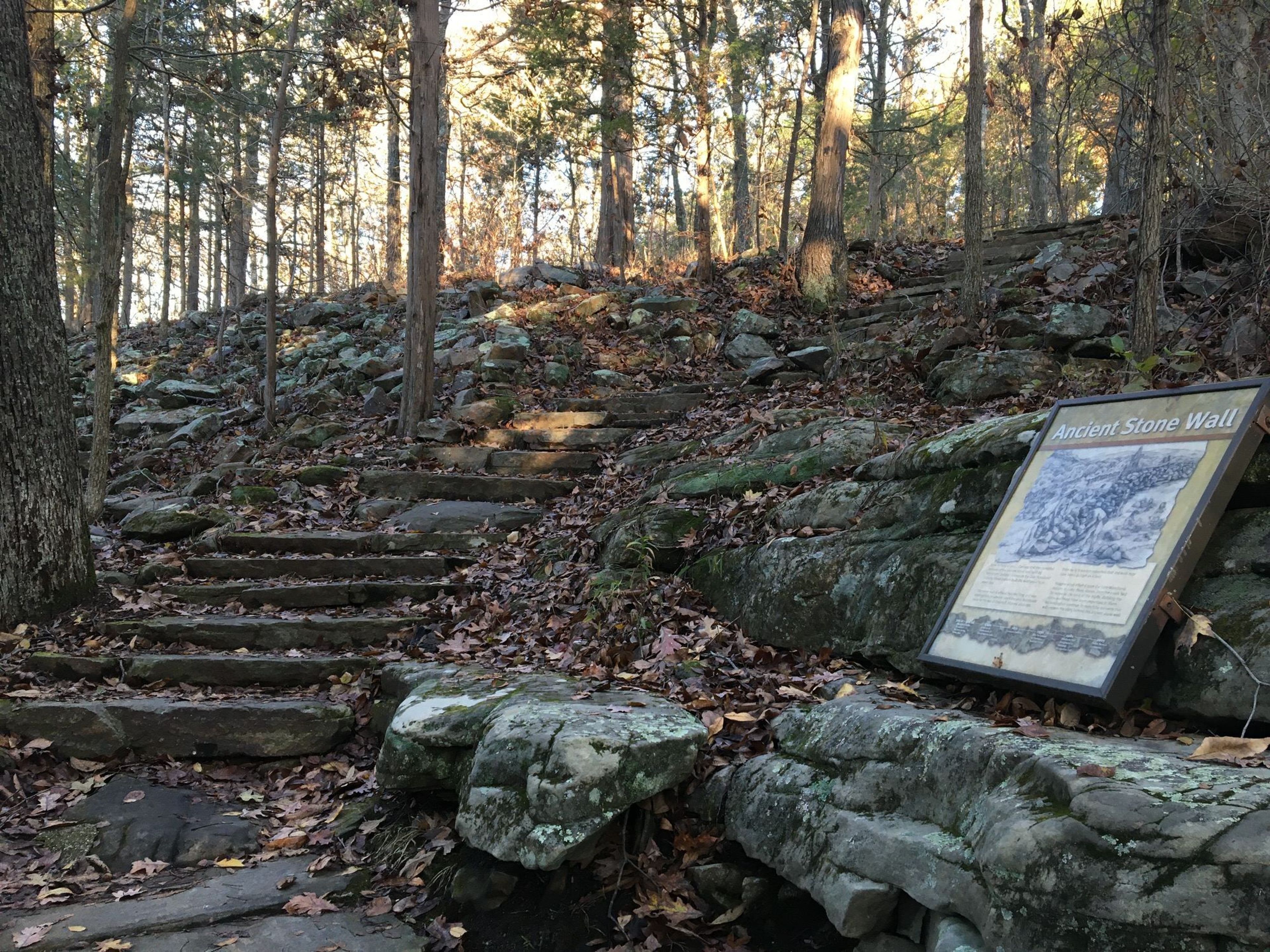 The upper trail passes through a prehistoric stone wall built by Native Americans. Photo by Donna Kridelbaugh.