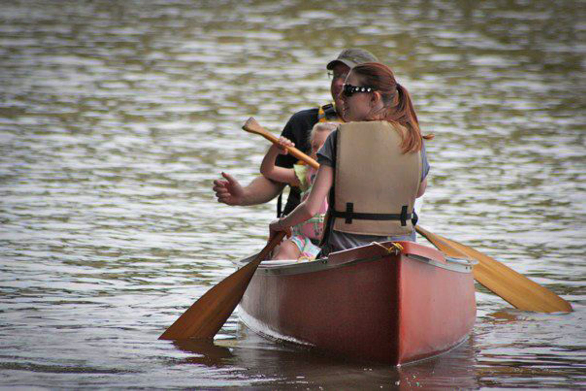 A family canoes on the Arkansas River.