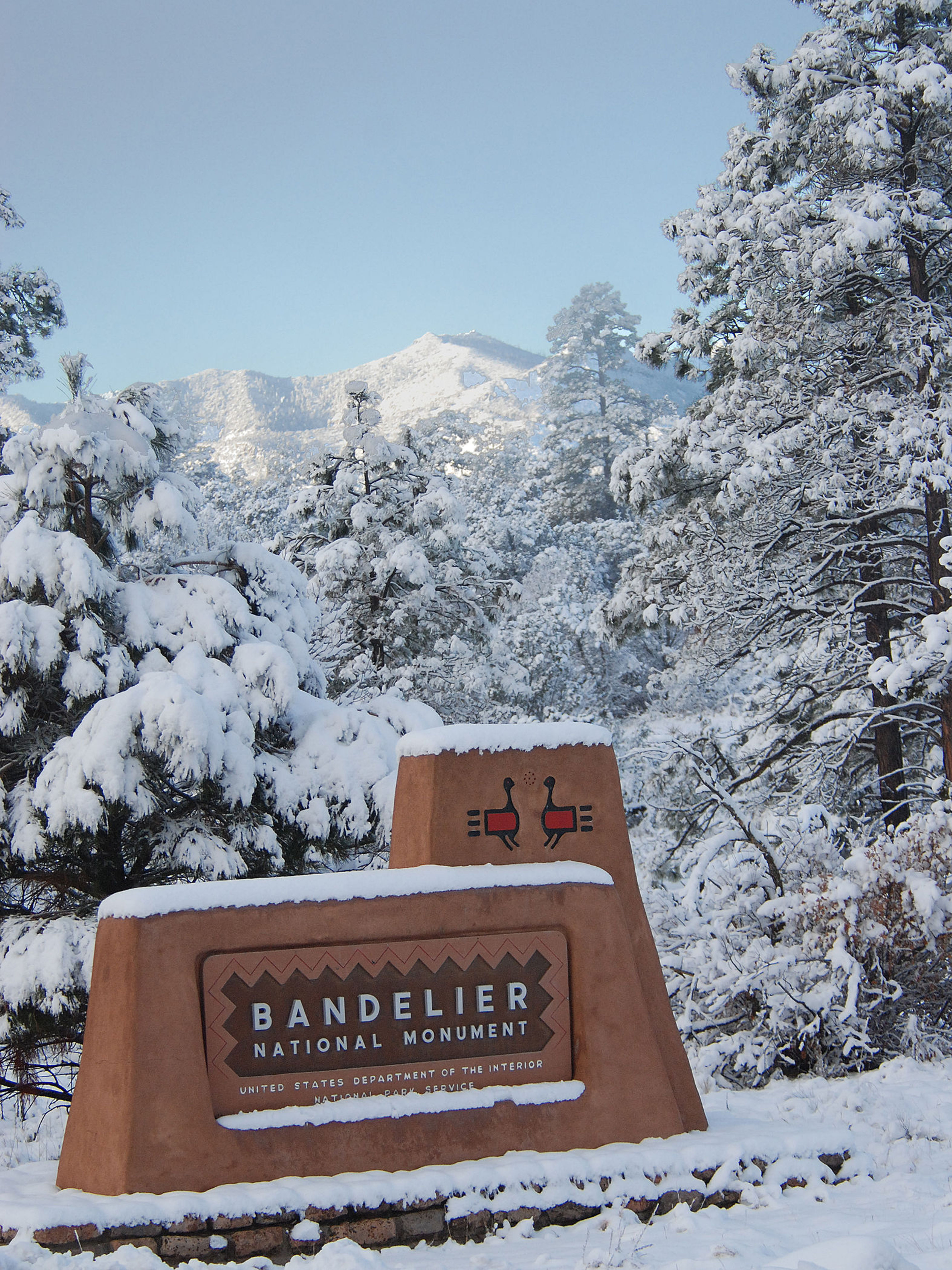 Park Entrance Sign in Winter. Photo by Sally King courtesy NPS.