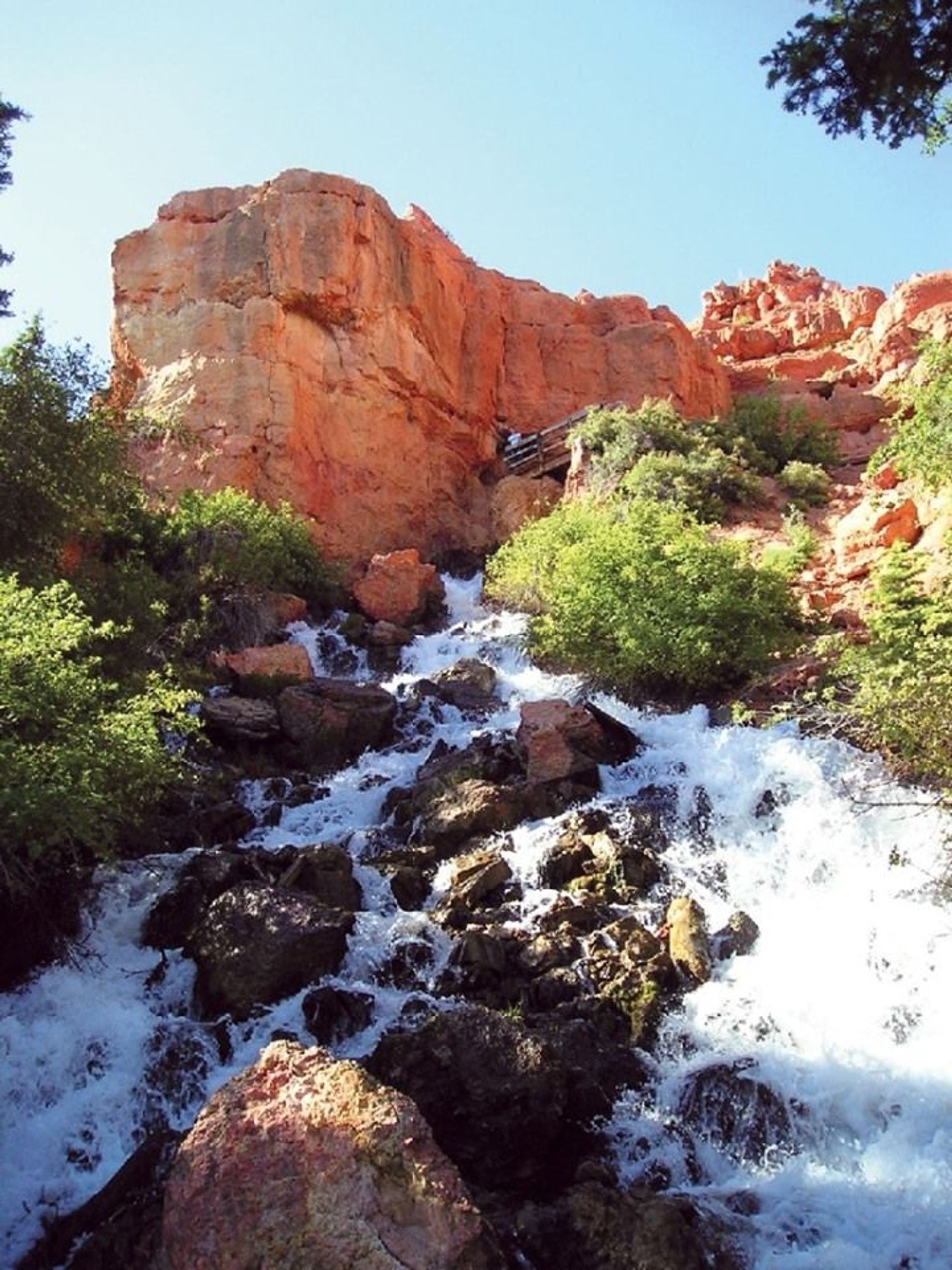 Cascade Falls just below the cave opening, forming the headwaters of the North Fork of the Virgin River. Photo by Lance Weaver, Utah Geo. Survey.