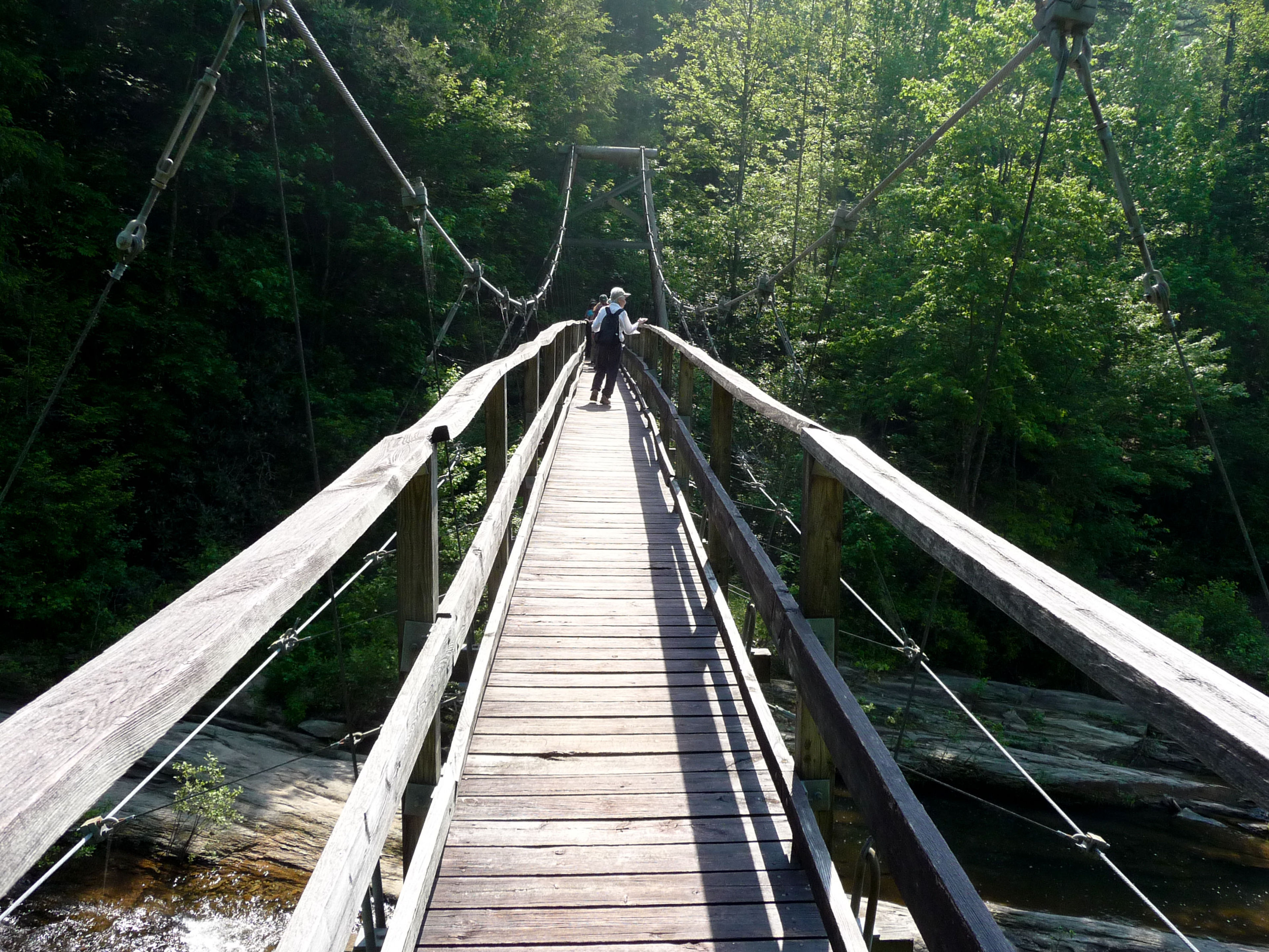 Crossing the Toxaway River suspension bridge. Photo by Debbie Biddle.