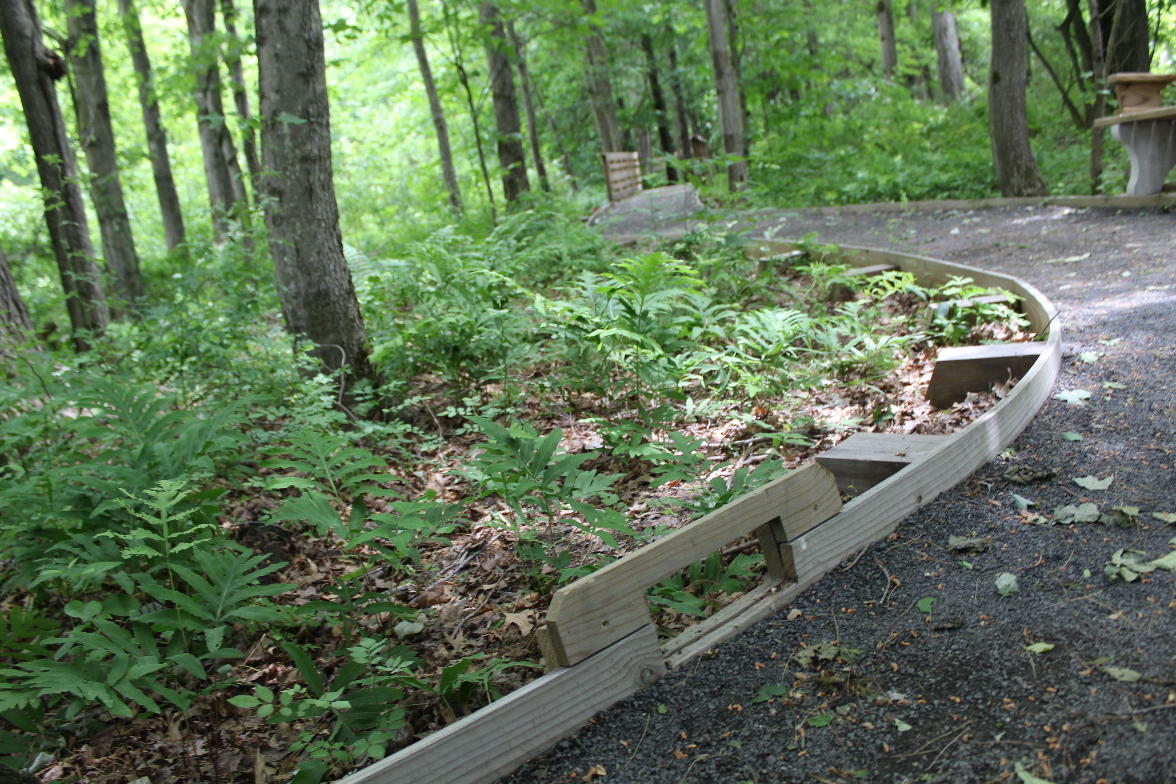 Critter escapes are placed frequently along the trail to keep small animals from getting trapped on the trail.