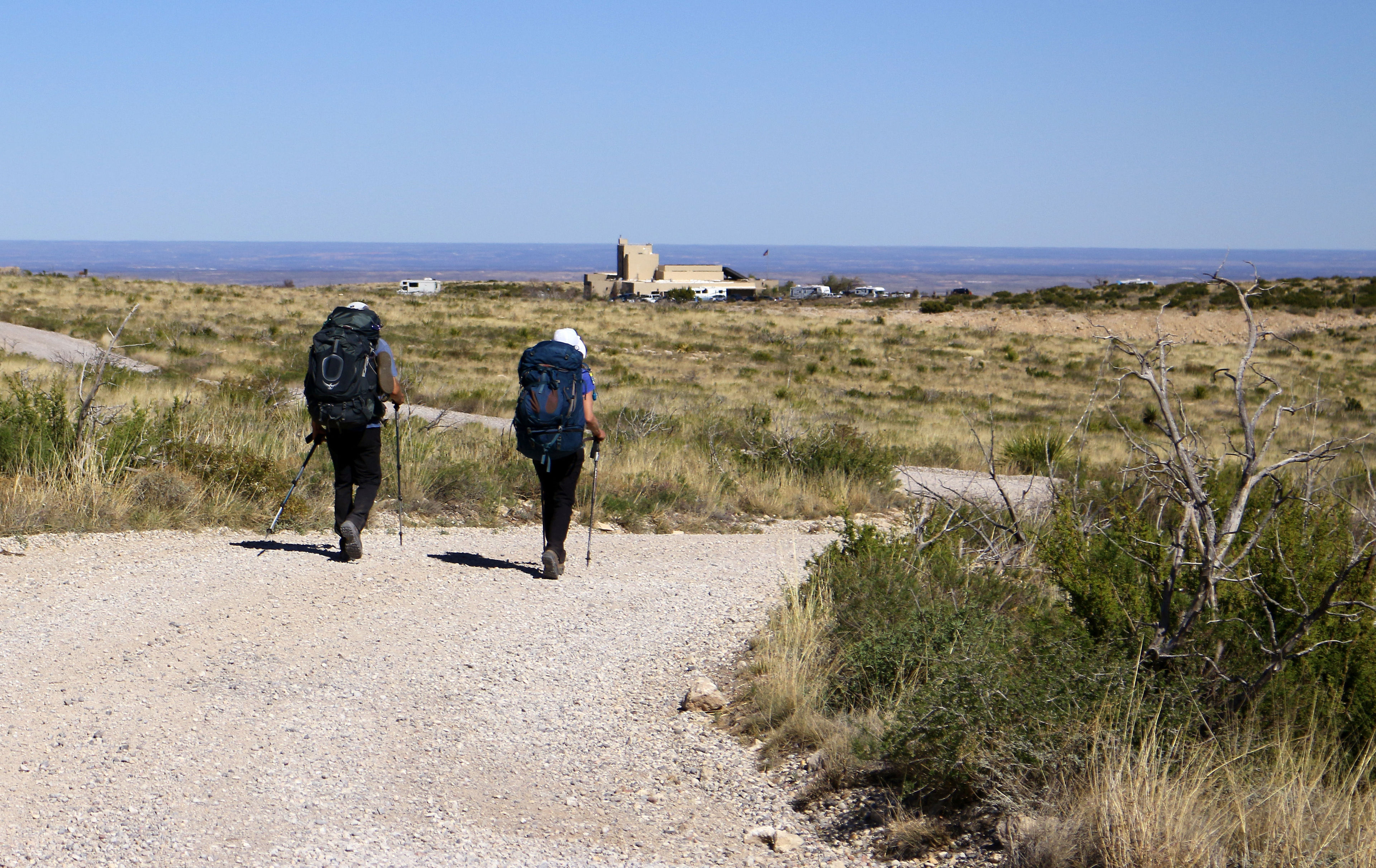 View of Guadalupe Ridge Trail as hikers near Carlsbad Caverns National Park, New Mexico. This is an excellent opportunity for hikers to stop in to visit the Caverns, use restroom facilities, dine at the park cafeteria, and use watering stations. Credit: