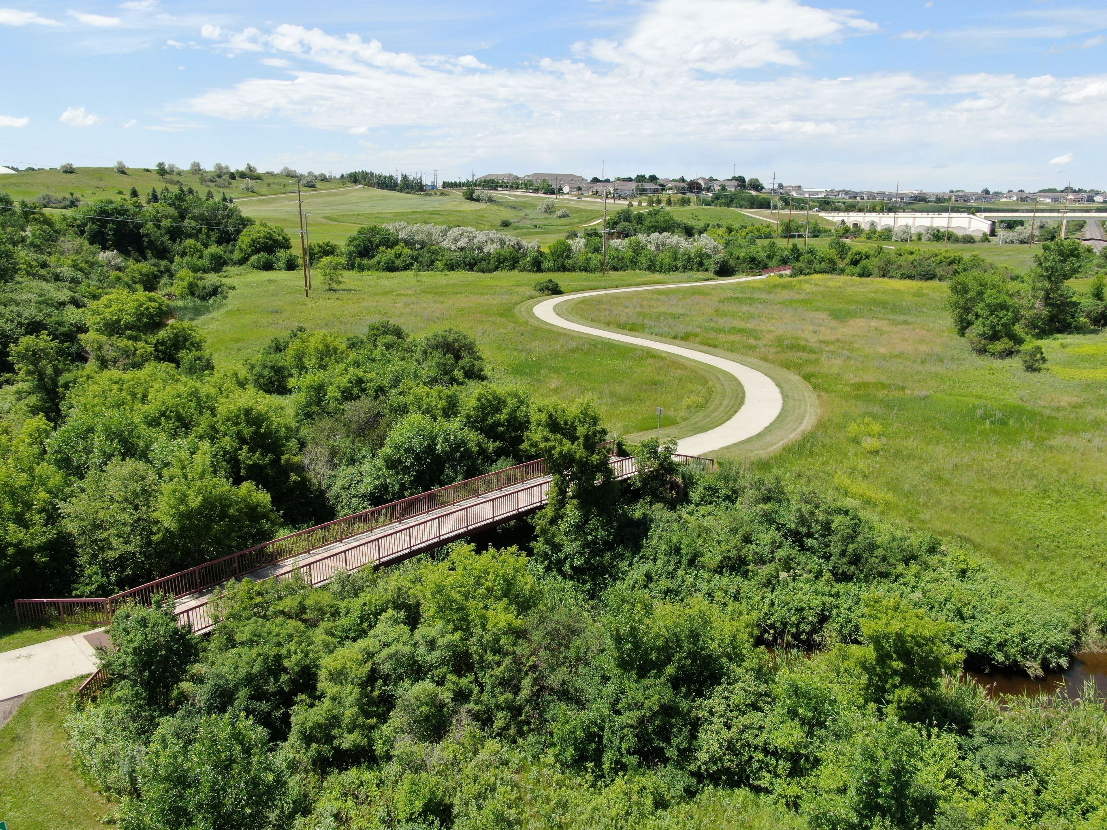 Bridge and path along the Hay Creek Trail. Photo by Bismarck Parks and Rec.