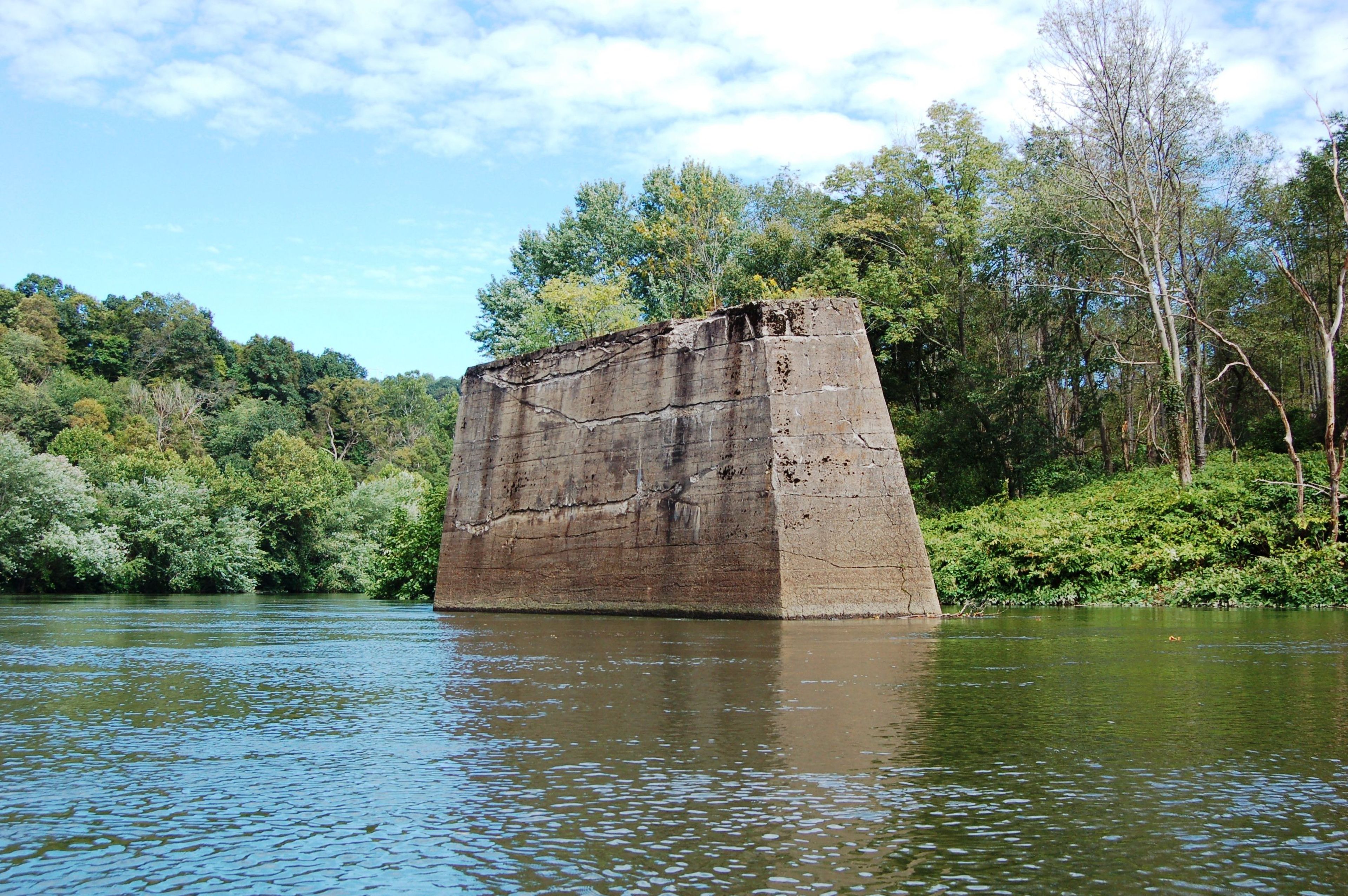 An abandoned railroad bridge pier