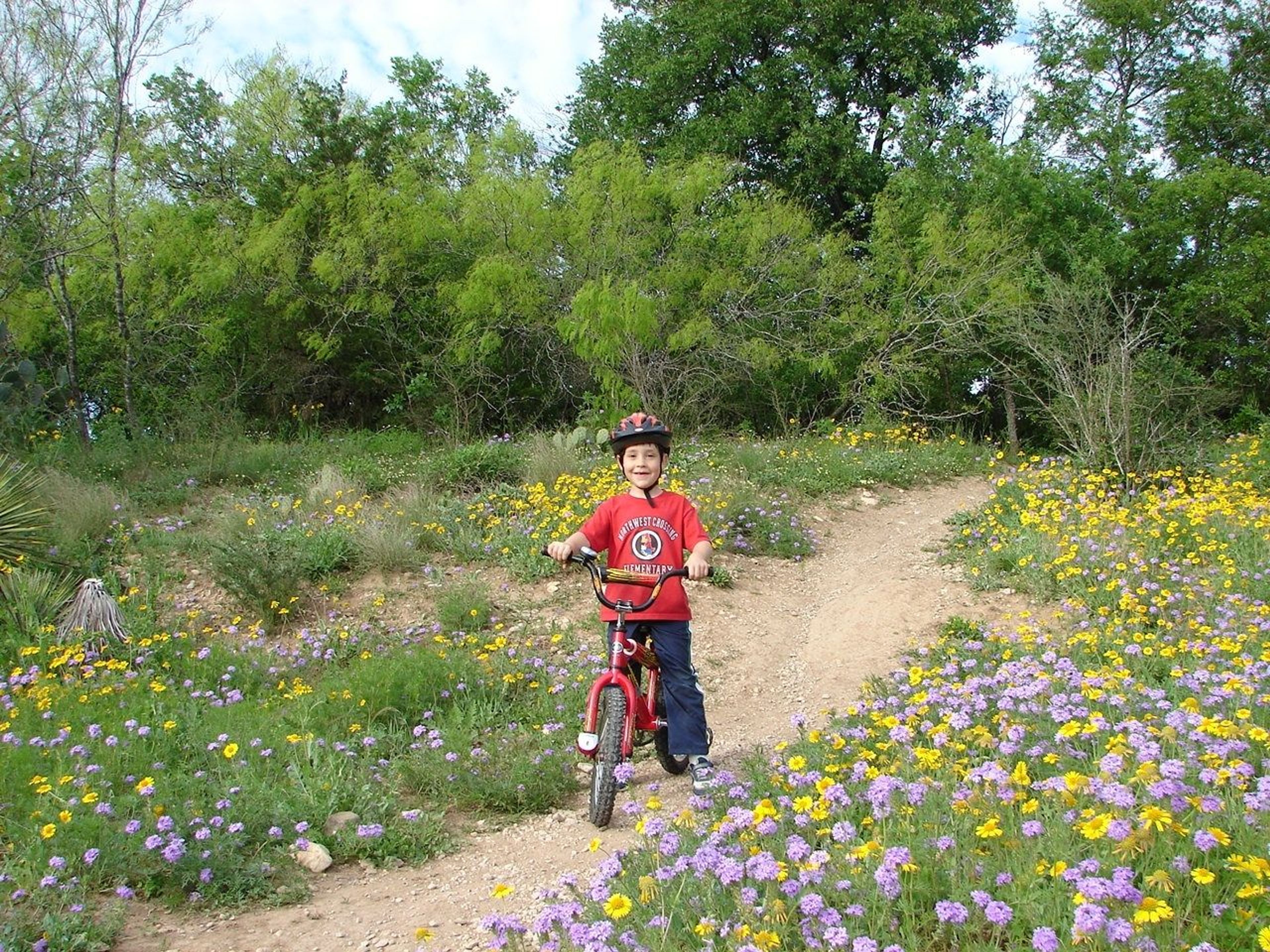 Young cyclist on Leon Greenway. Photo by Jody Castro.