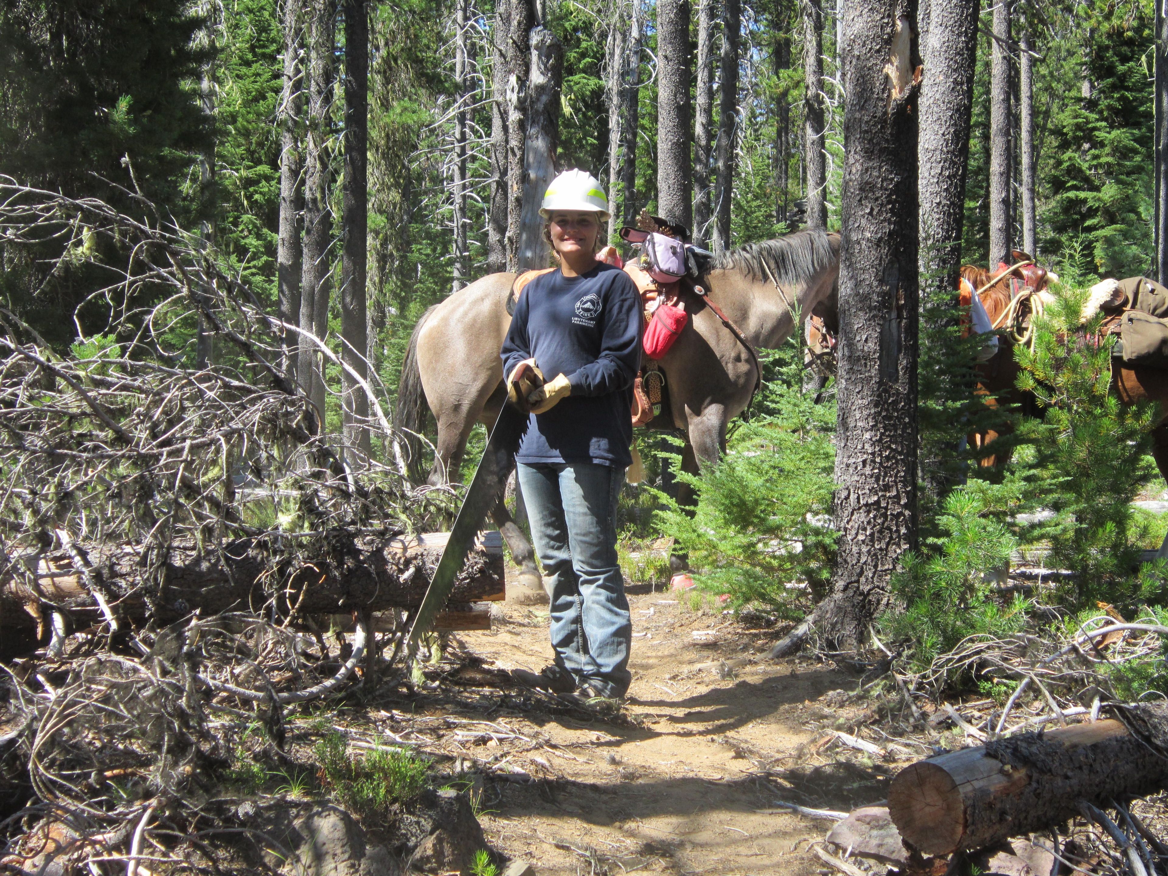 East Cascade Back Country Horsemen crew logging out trees to open the trail for use. Photo by Linda Thomas.