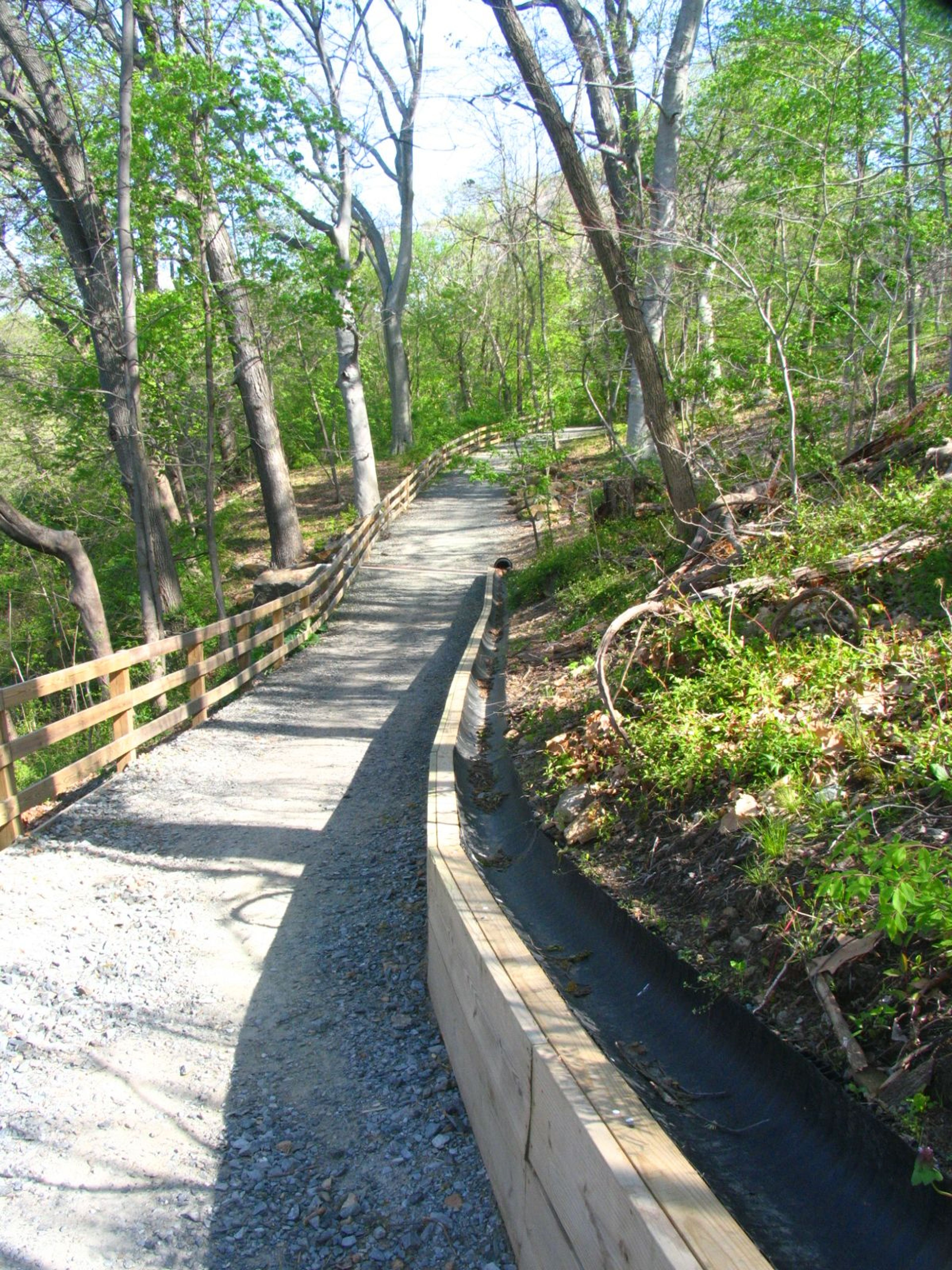 New erosion control structure diverts runoff off the Northern Delaware Greenway Trail to allow for sustainable use. Photo by Delaware State Parks.