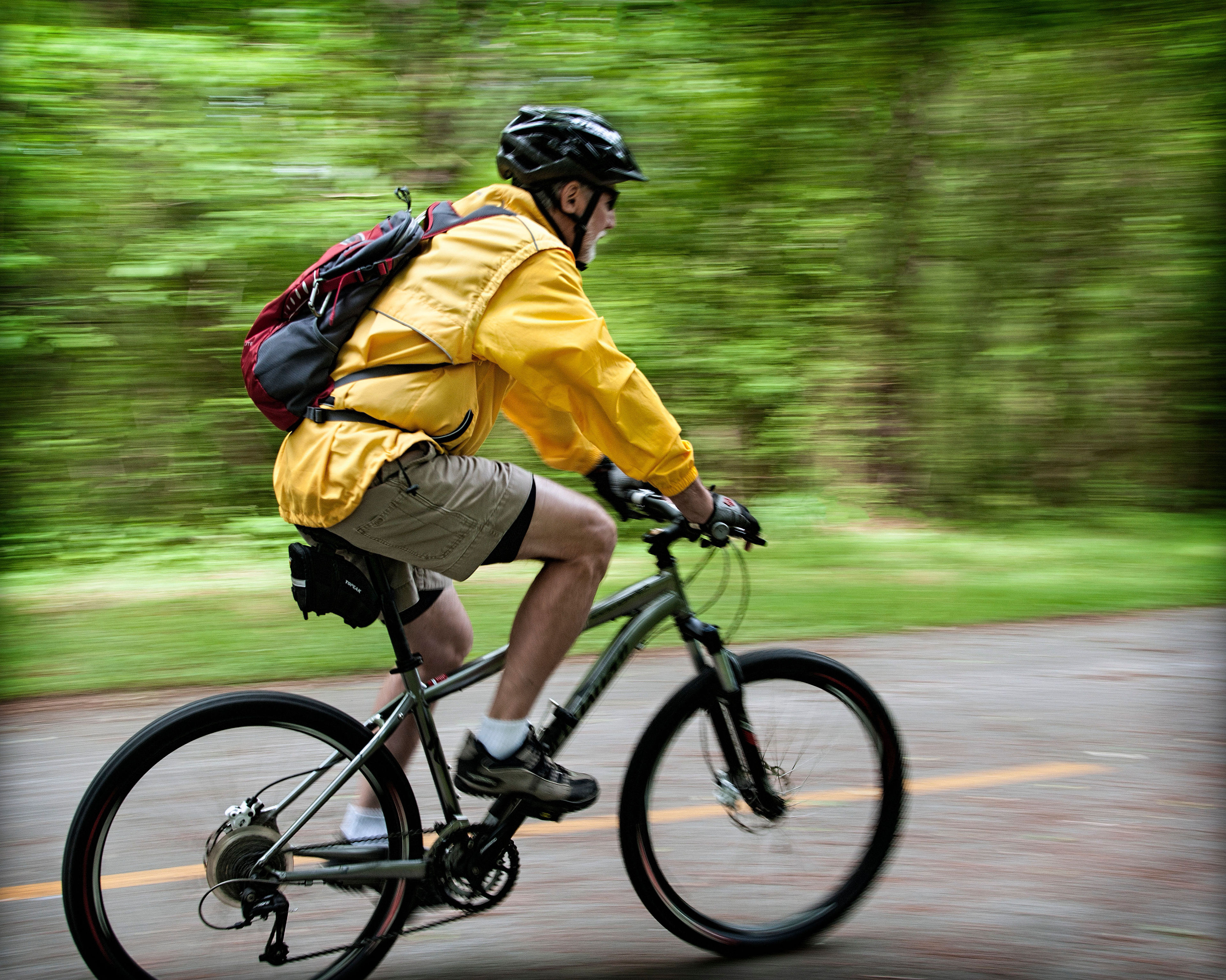 A panning shot of a bicyclist on the Silver Comet Trail. Photo by Clara Williams.