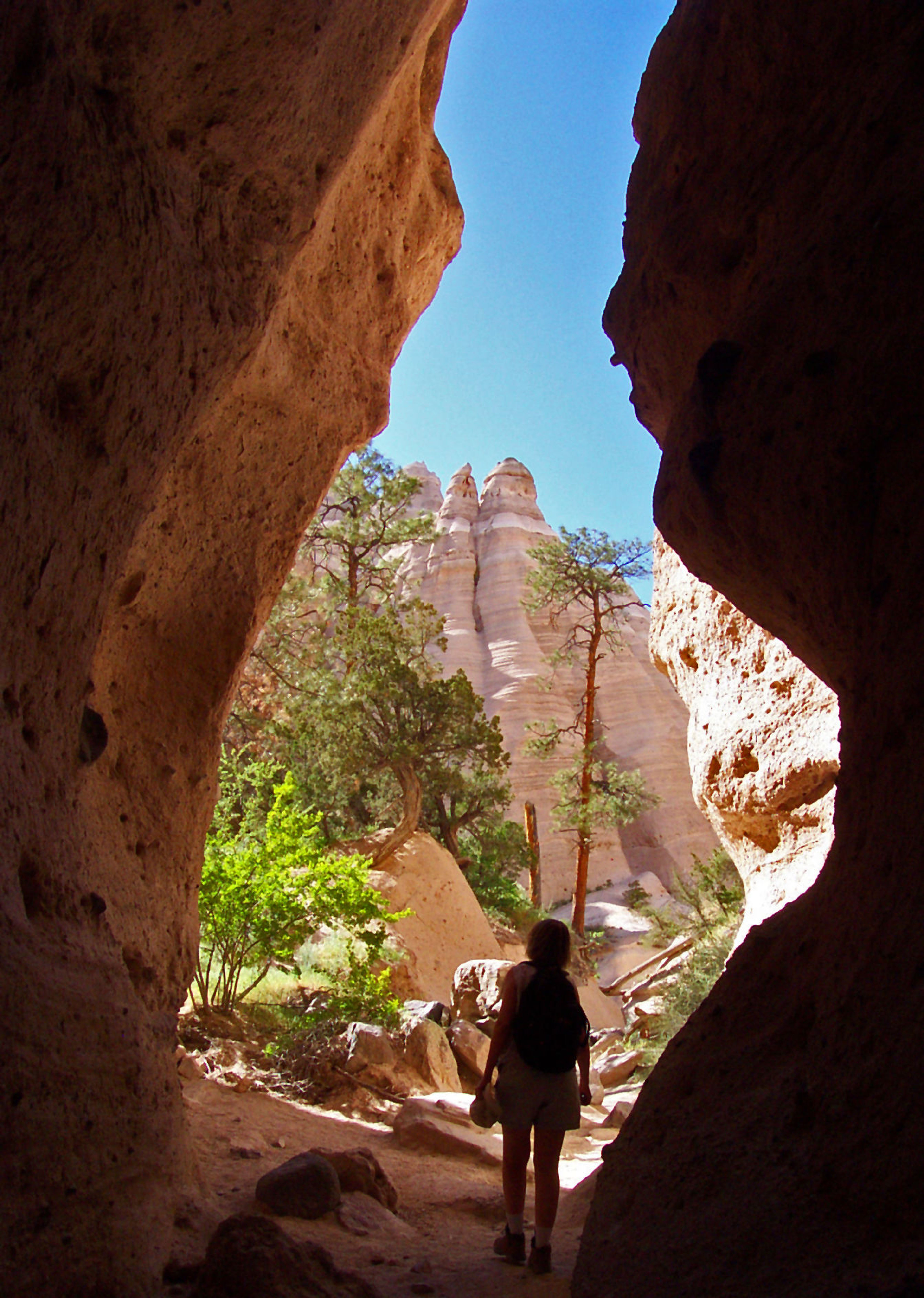 Hiker reaches the end of the slot on Tent Rocks Trail. Photo by Stephen Ausherman.