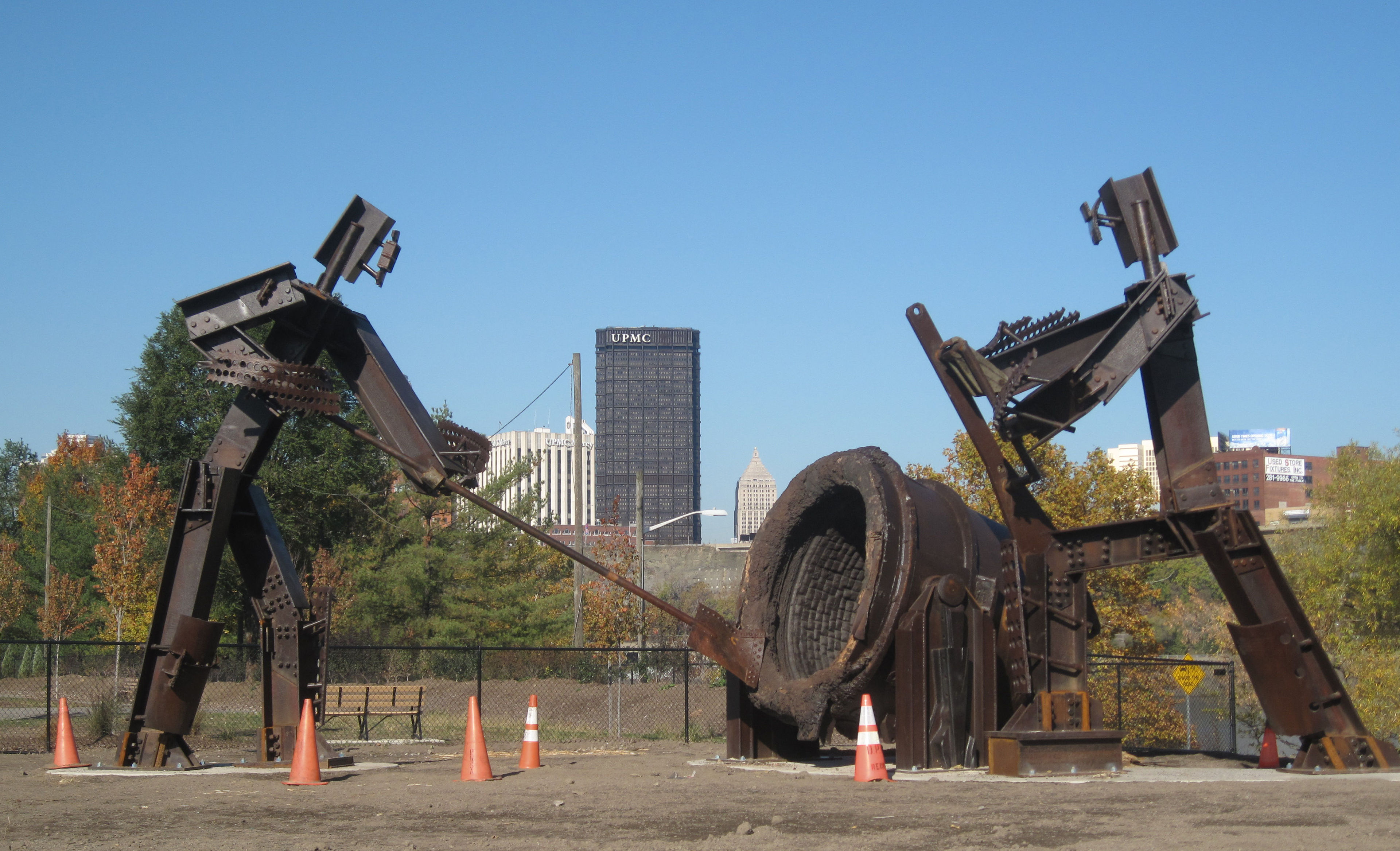 The Workers. Two 18-foot metal steelworkers stand beside the trail. Photo by Mary Shaw.