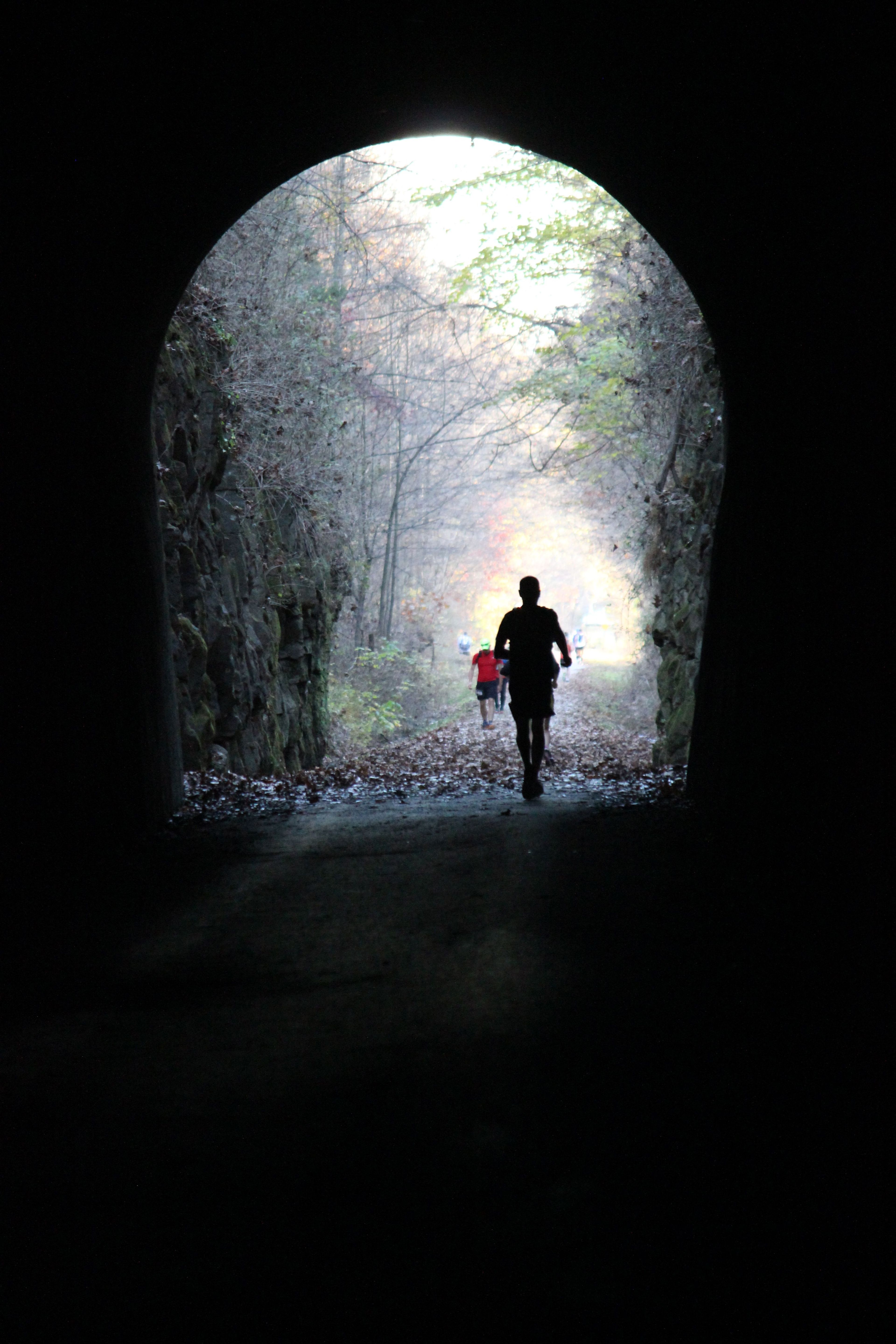 Runners through the tunnel. Photo by Jonathan Voelz.