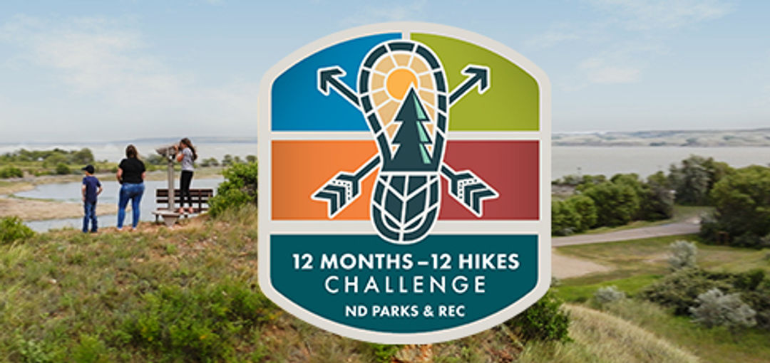 2024 12 Months-12 Hikes Challenge logo over a scenic photo of an overlook at Lewis & Clark State Park
