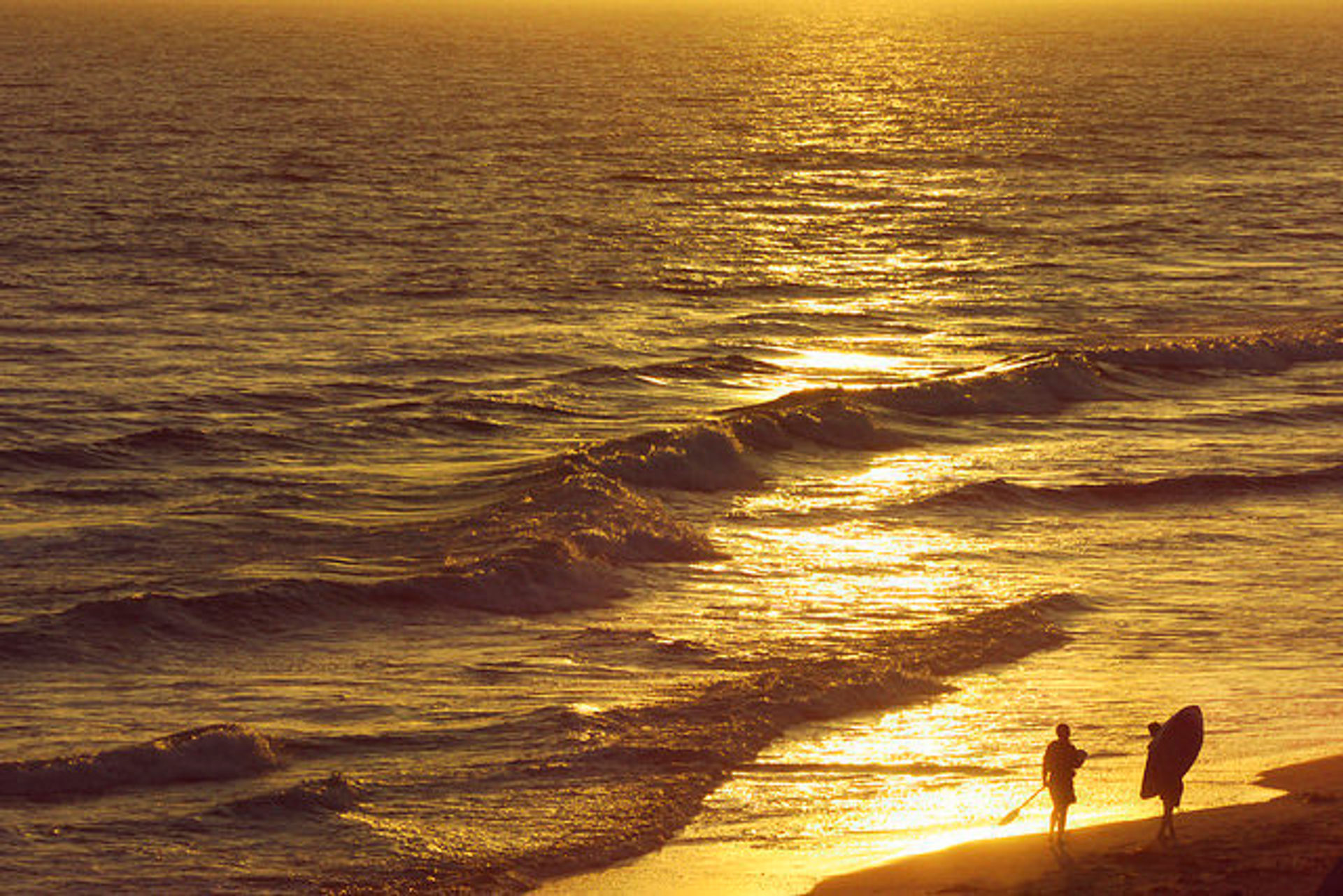 Paddleboard and sunset on Huntington Beach SB