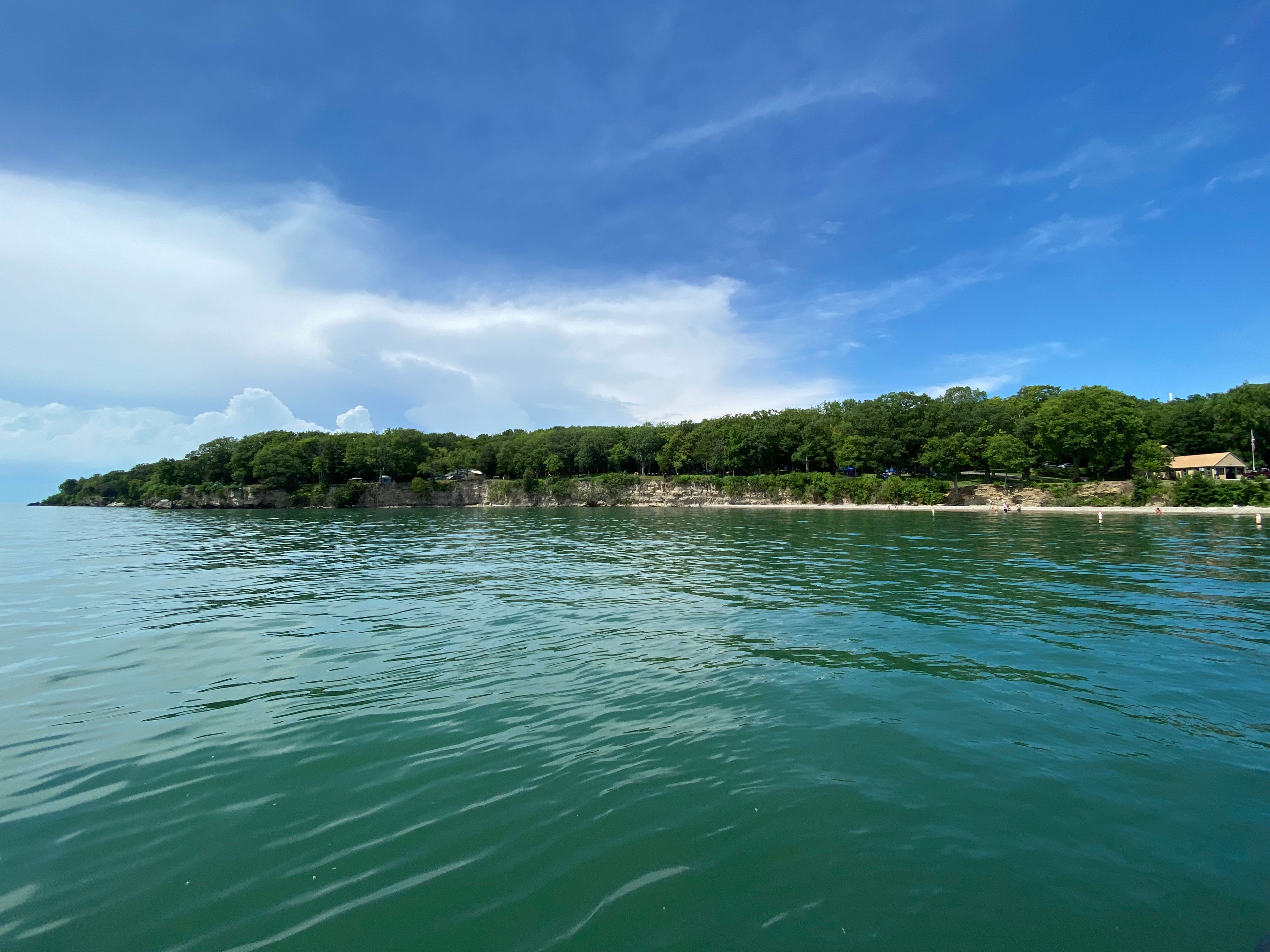 a view of south bass island from the blue waters and blue skies