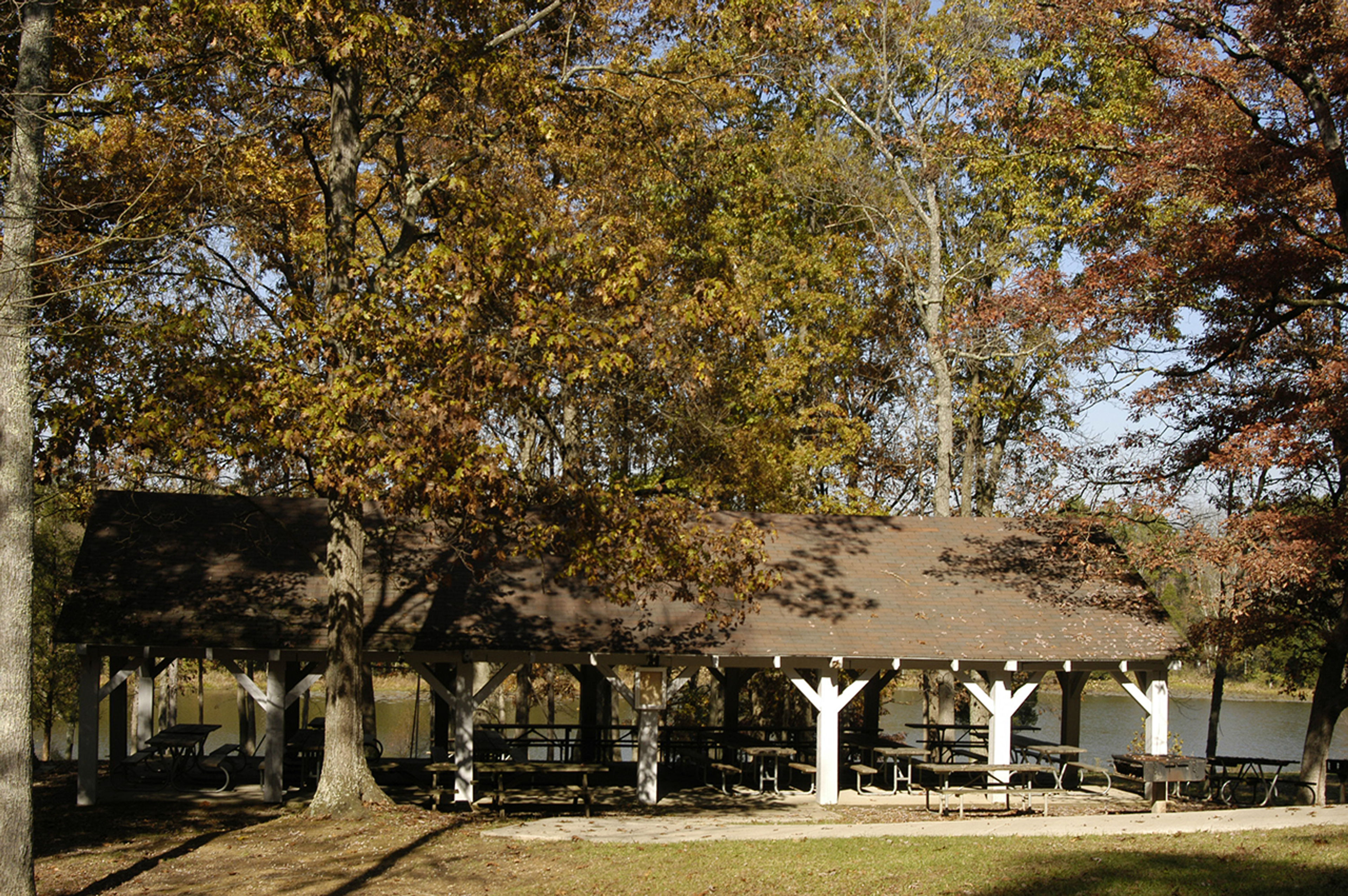 Shelter house surrounded by trees in early autumn at Adams Lake State Park