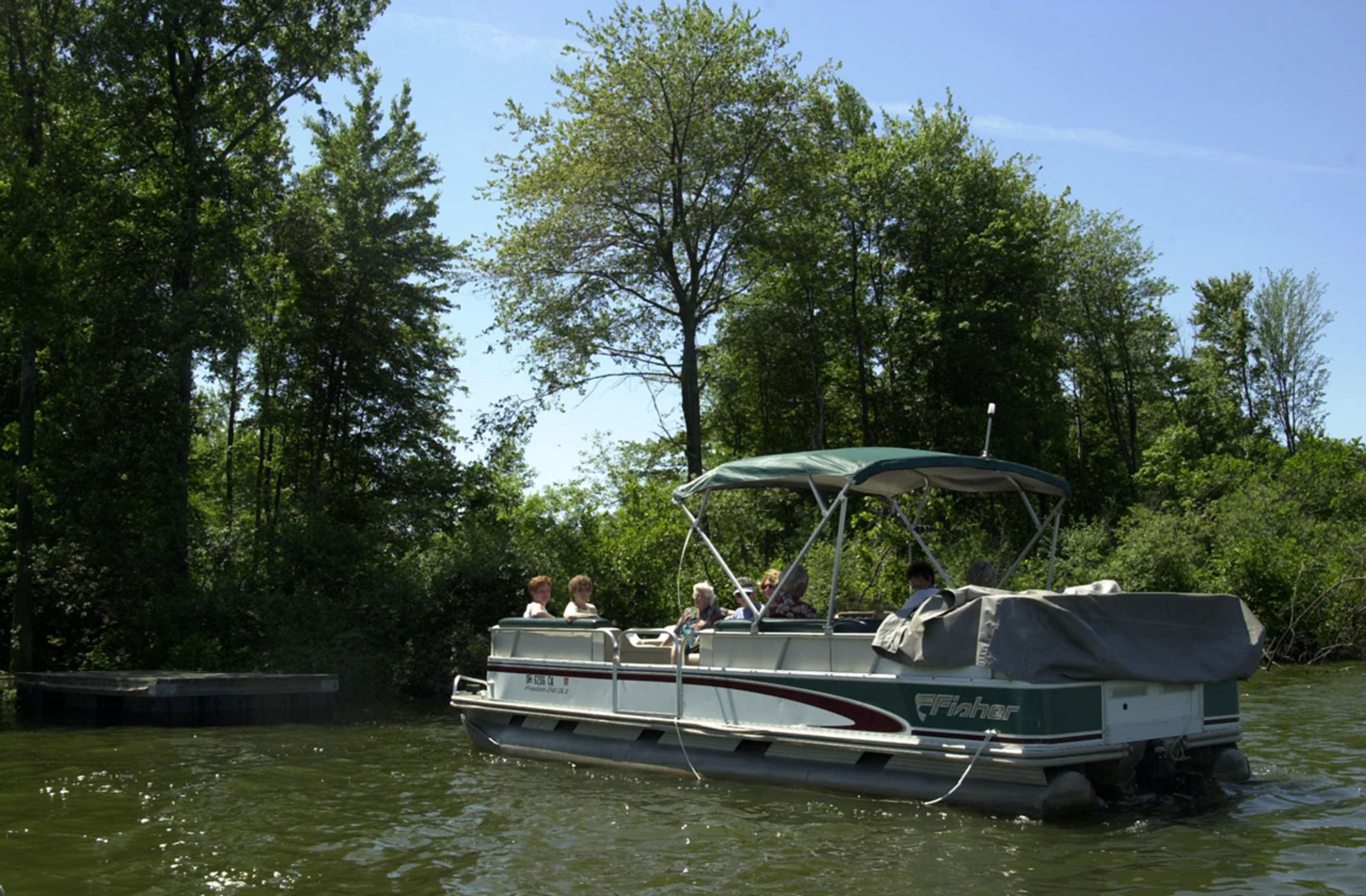 Group of people on a boat in the water at Buckeye Lake State Park.