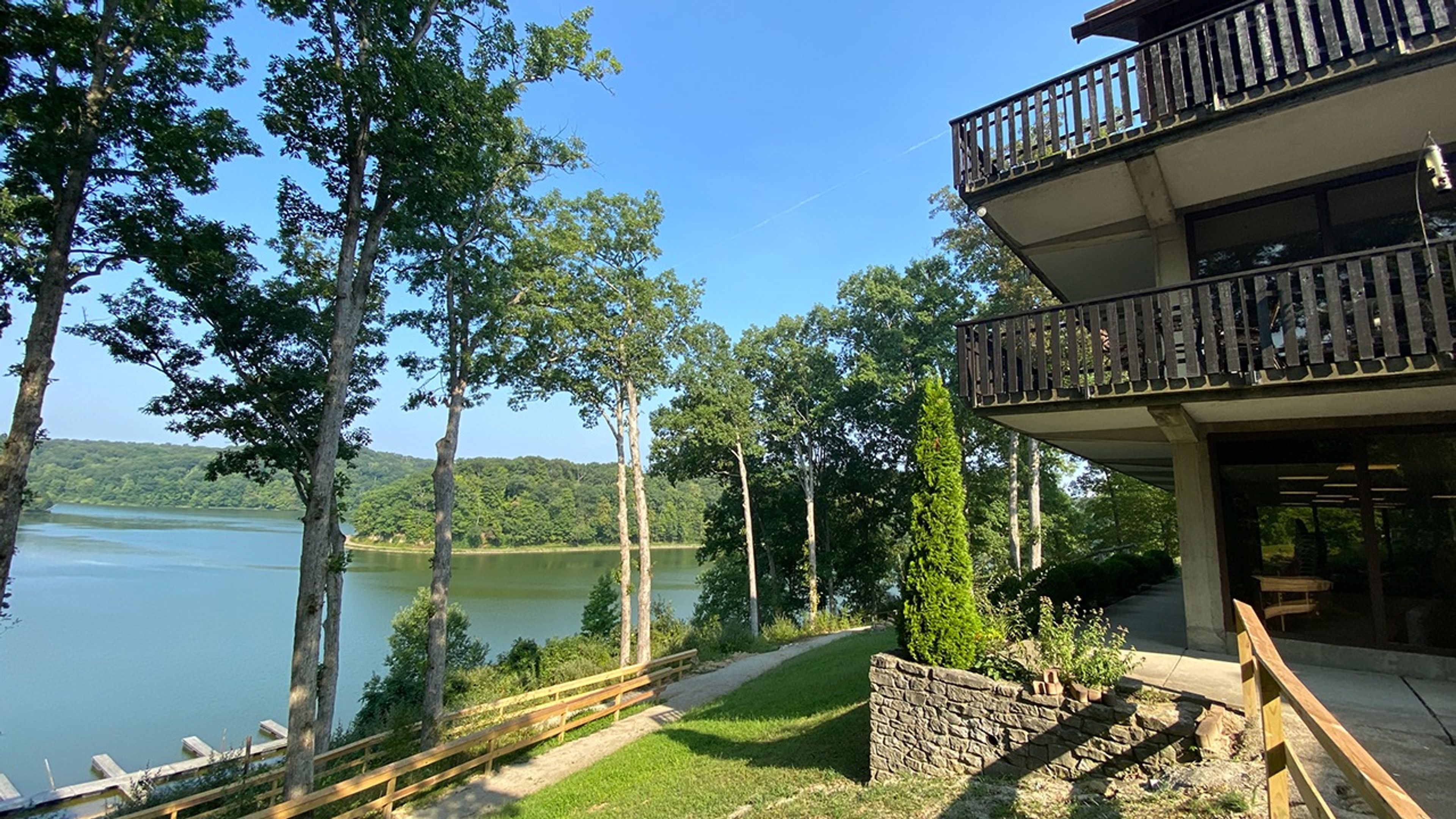 View of the lake and trees from the Burr Oak Lodge balconies at Burr Oak State Park.