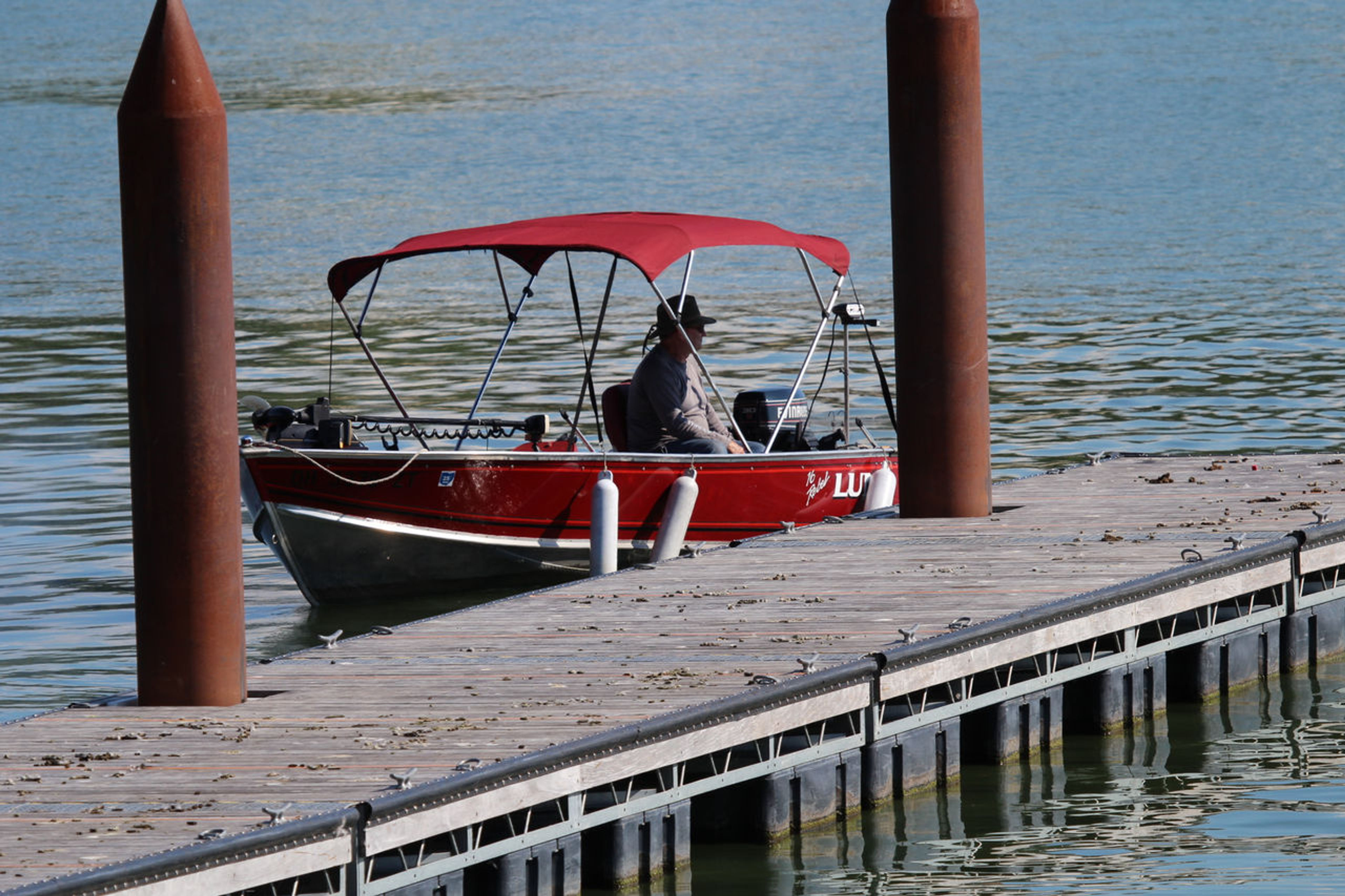 Person in a red boat on the water at Catawba Island State Park.