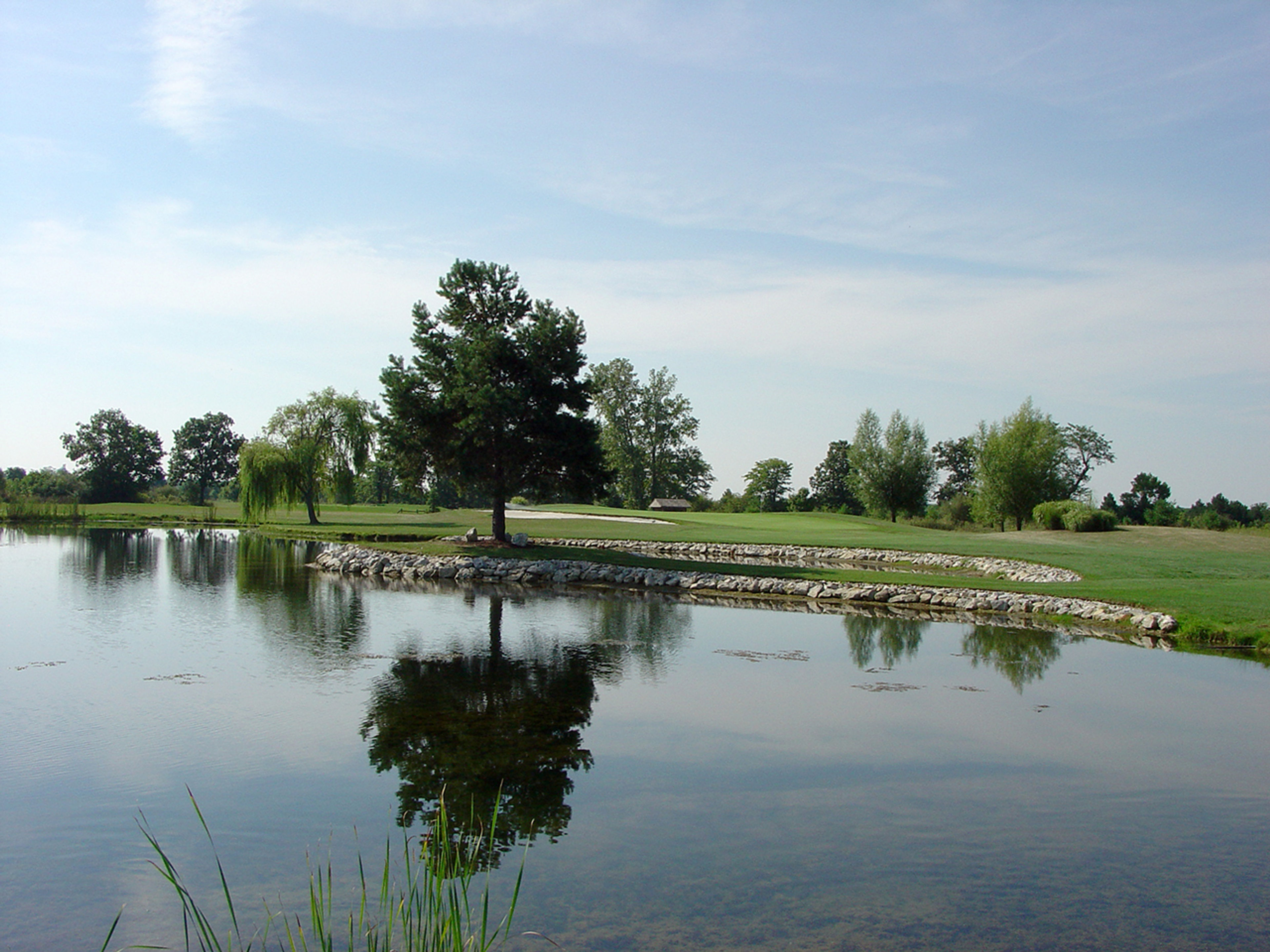 Pond in front of a golf course at Deer Creek State Park.