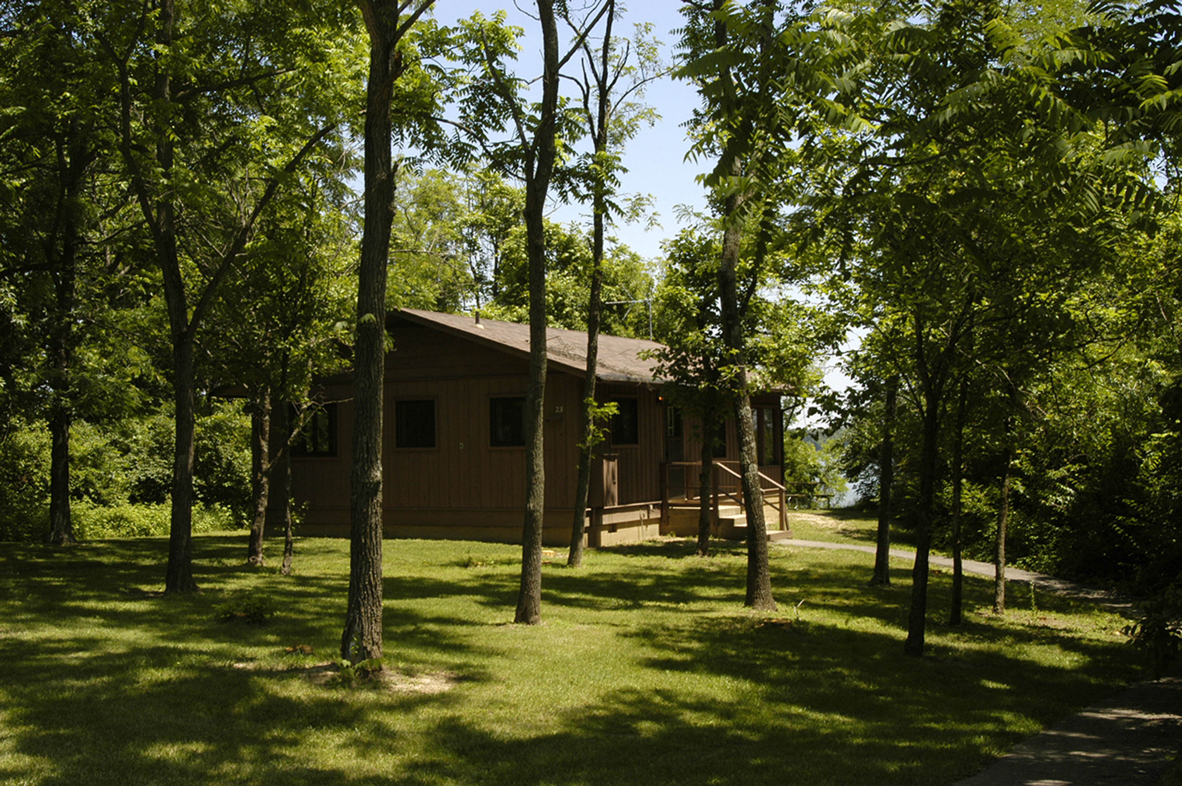 Cabin tucked back in a wooded area at Deer Creek State Park.