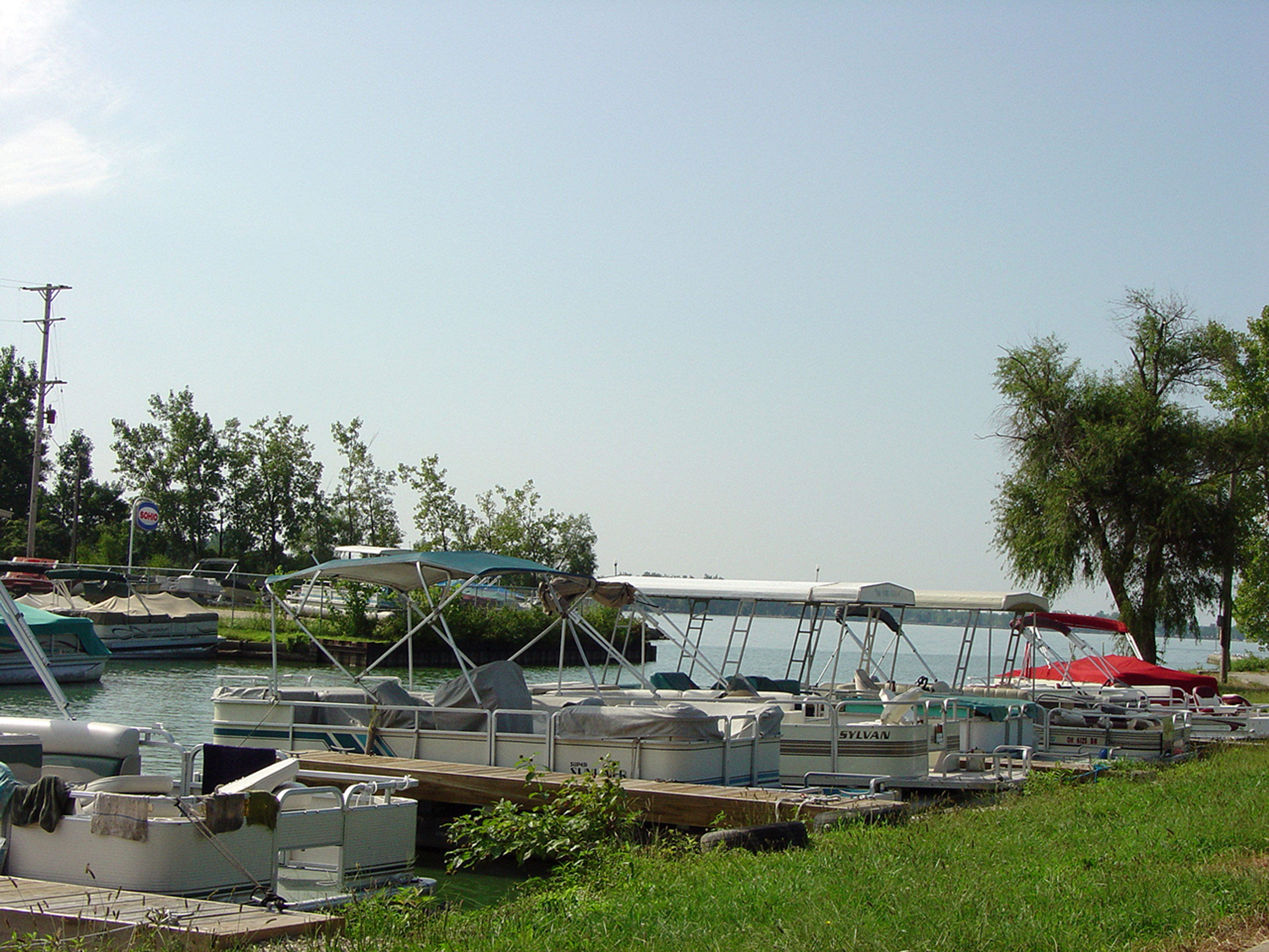 A line of five docked sailboats at Grand Lake St Marys State Park