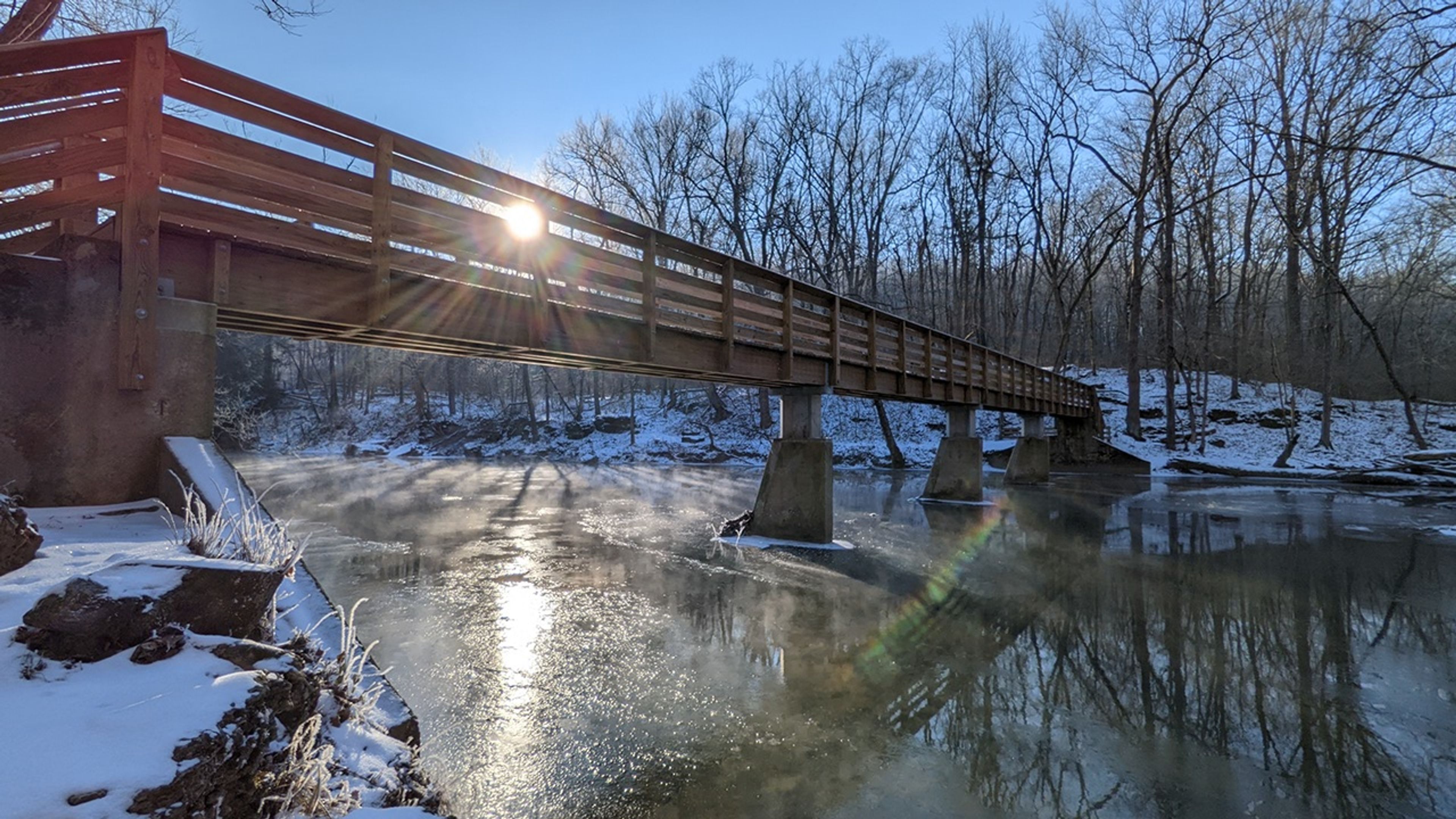 A bridge over a frozen river at John Bryan State Park