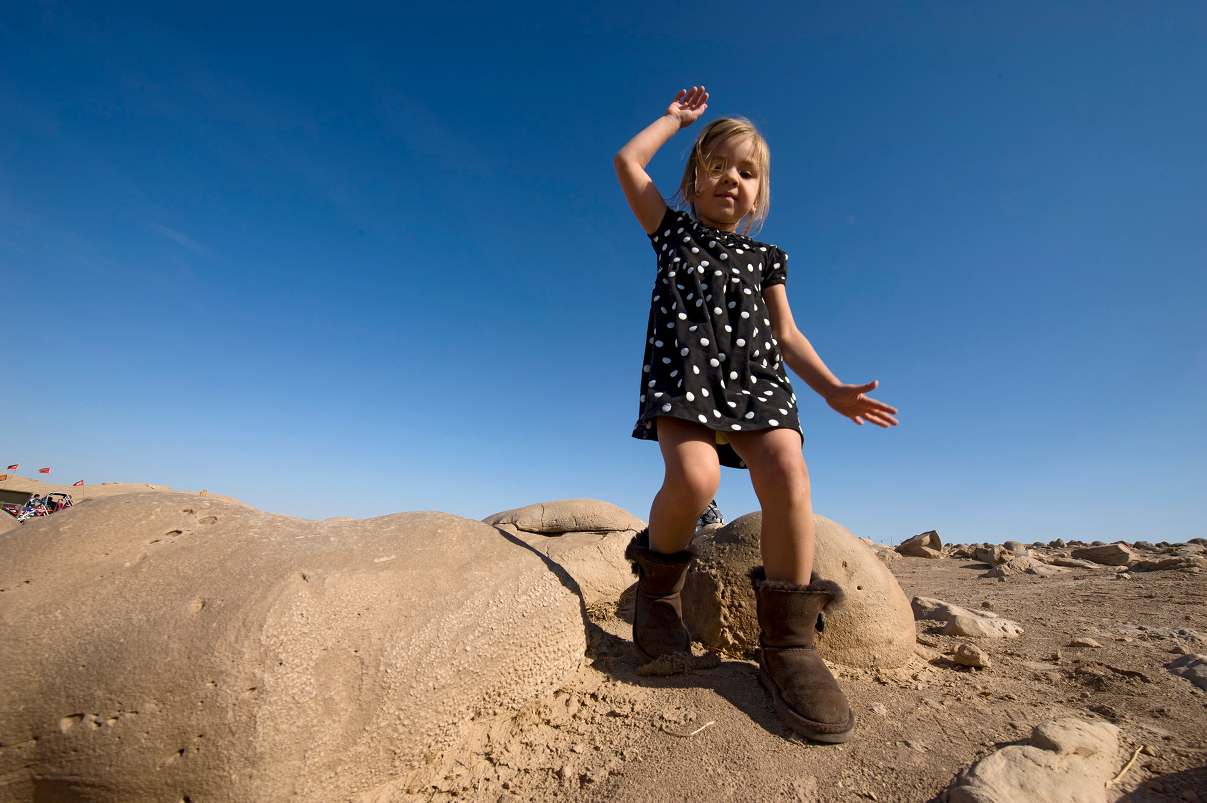 A young girls walks among the rocks on the Pumpkin Patch Trail at Ocotillo Wells.