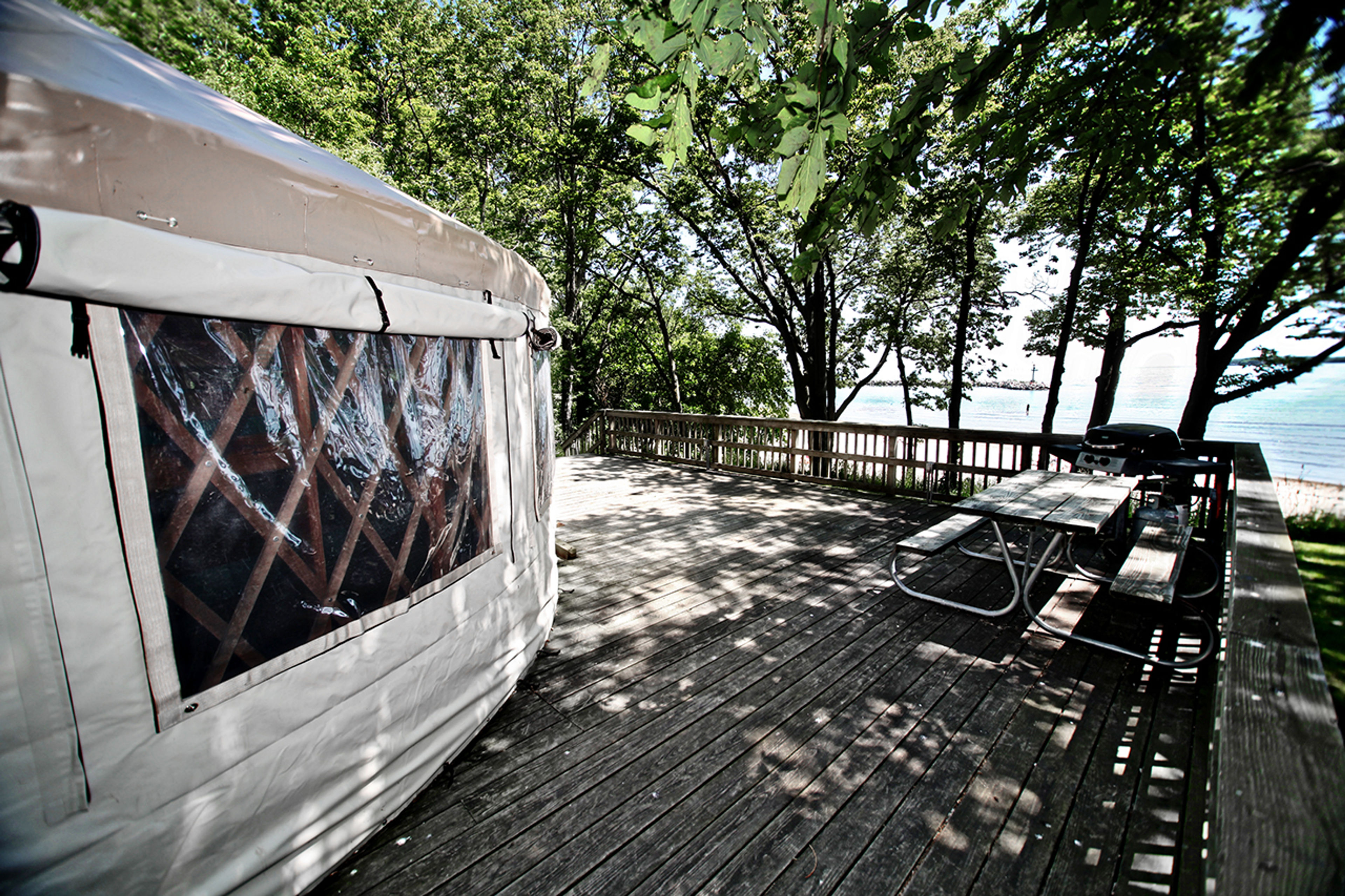 Yurt on a deck with a picnic bench at Kelleys Island State Park