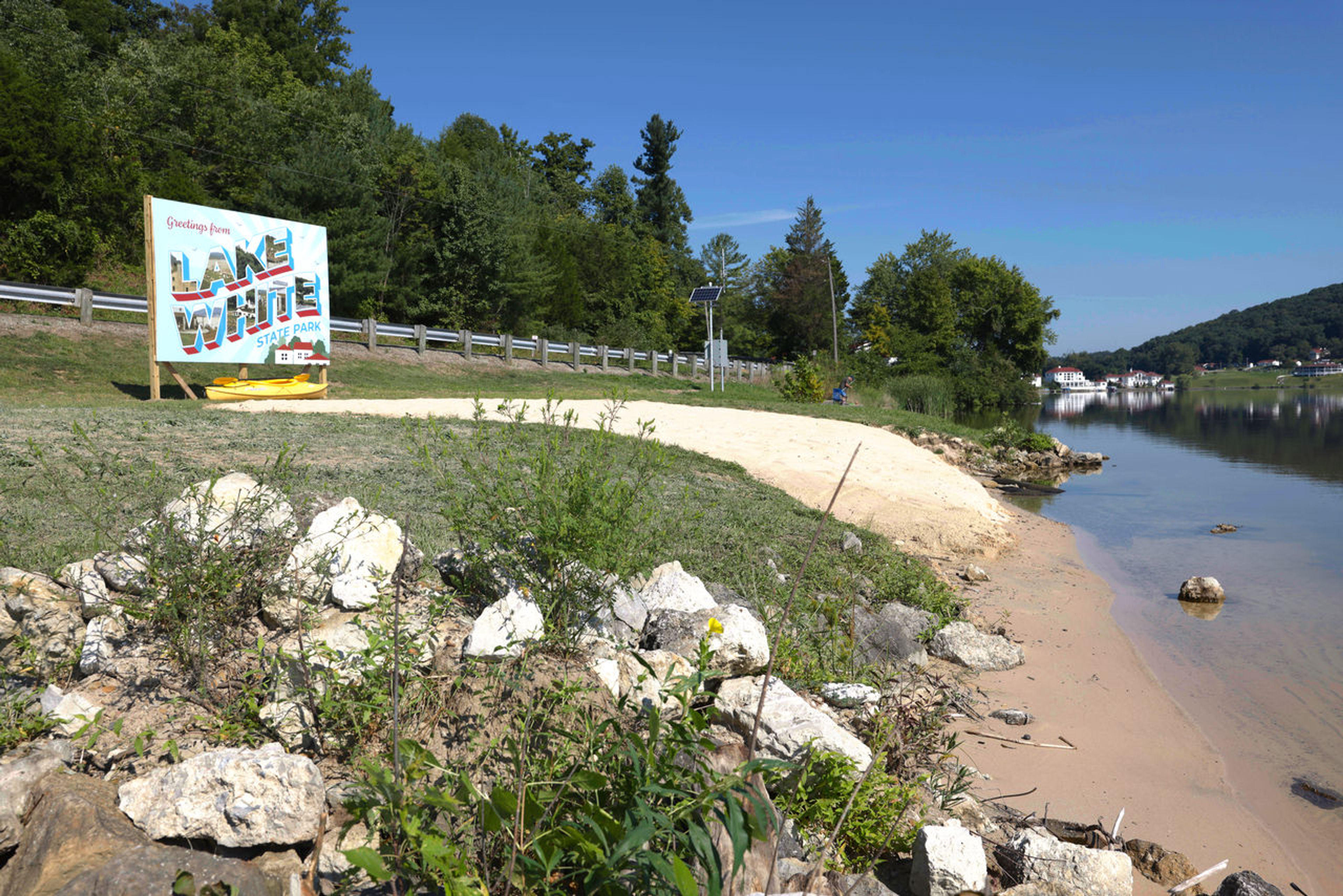 A sign that says “Lake White” on the lake shore at Lake White State Park