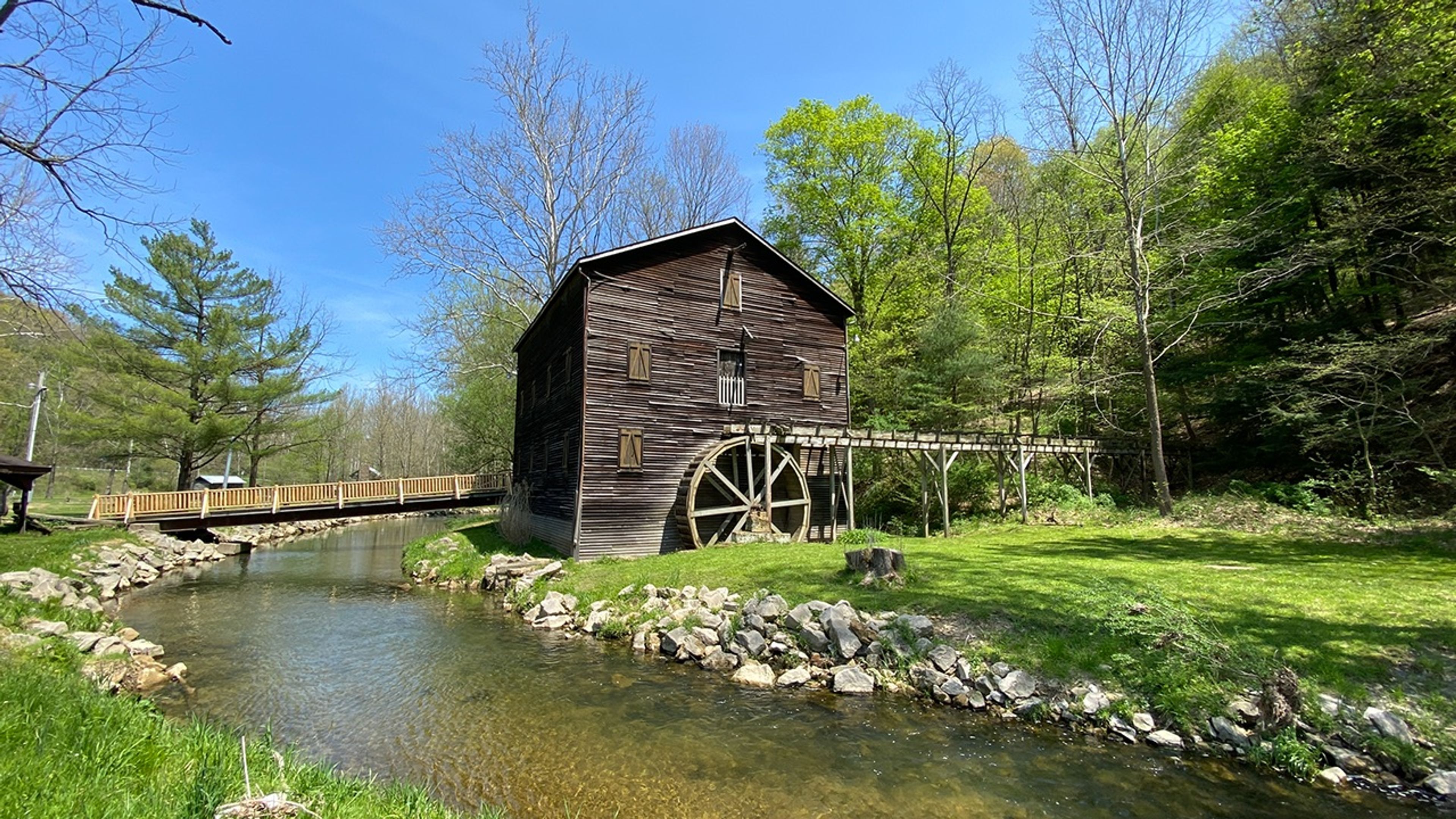 A water mill with a wooden wheel at Mohican State Park