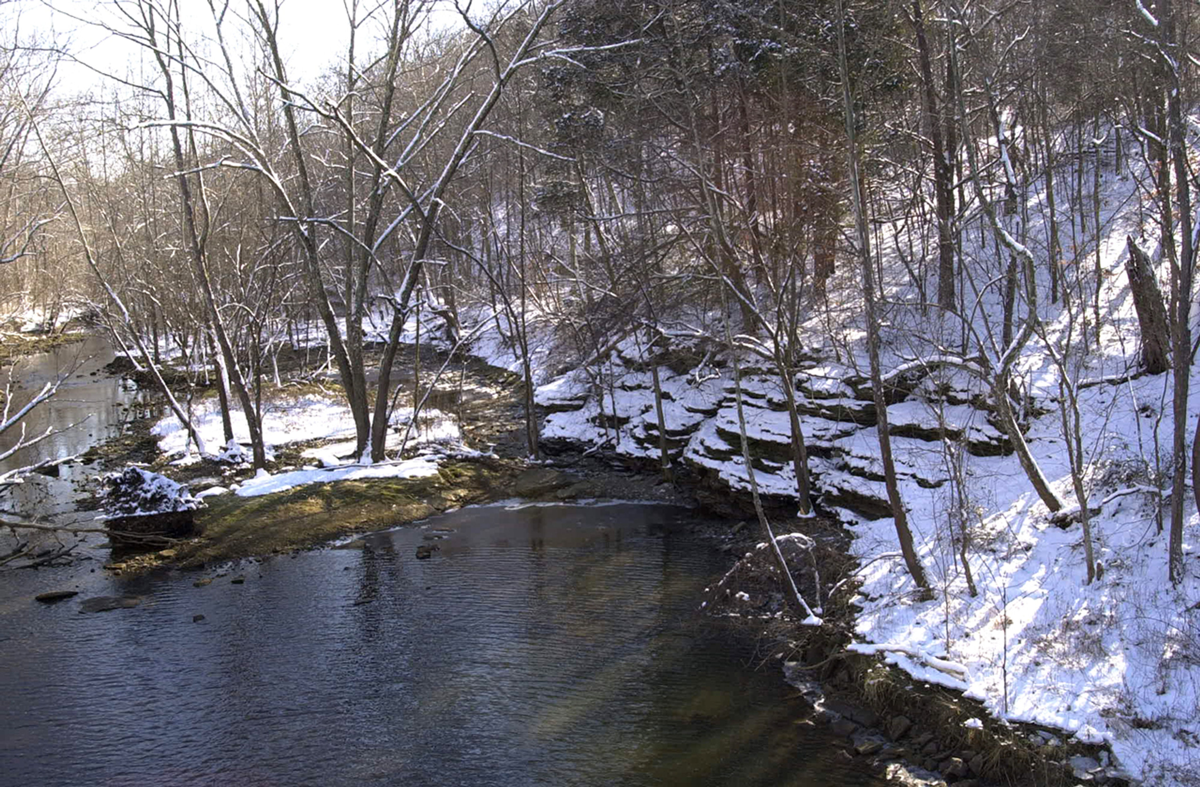 River in the woods with snow on the ground at Rocky Fork State Park