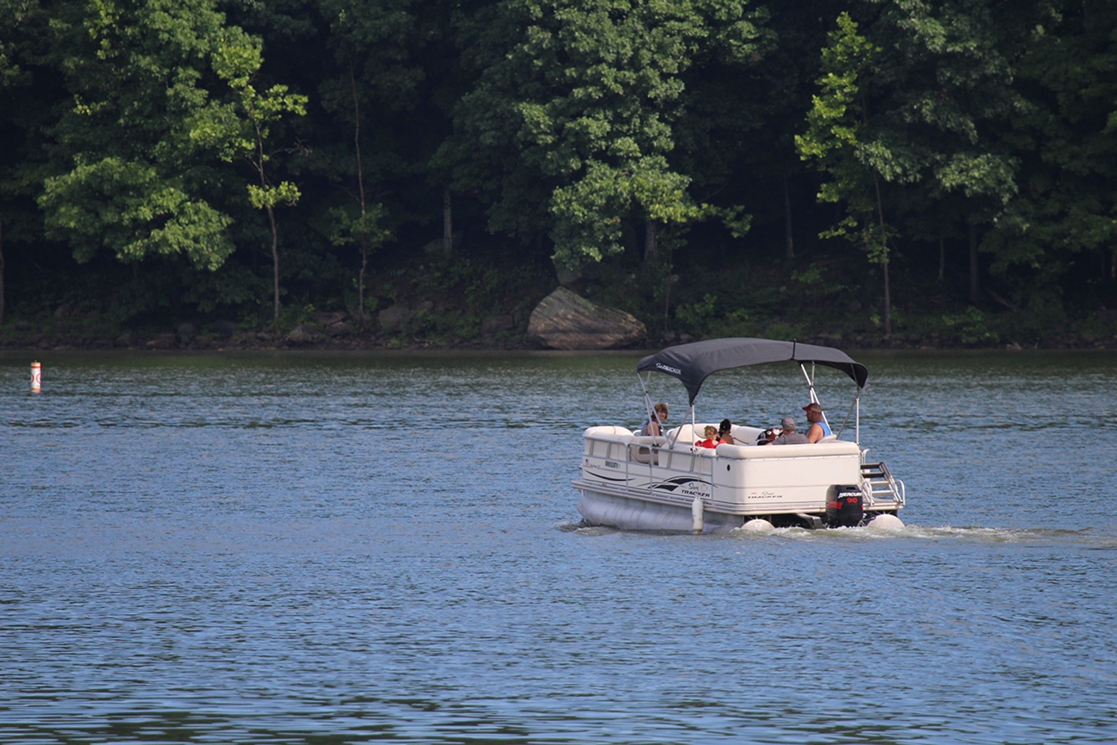 People in a boat on the water at Salt Fork State Park