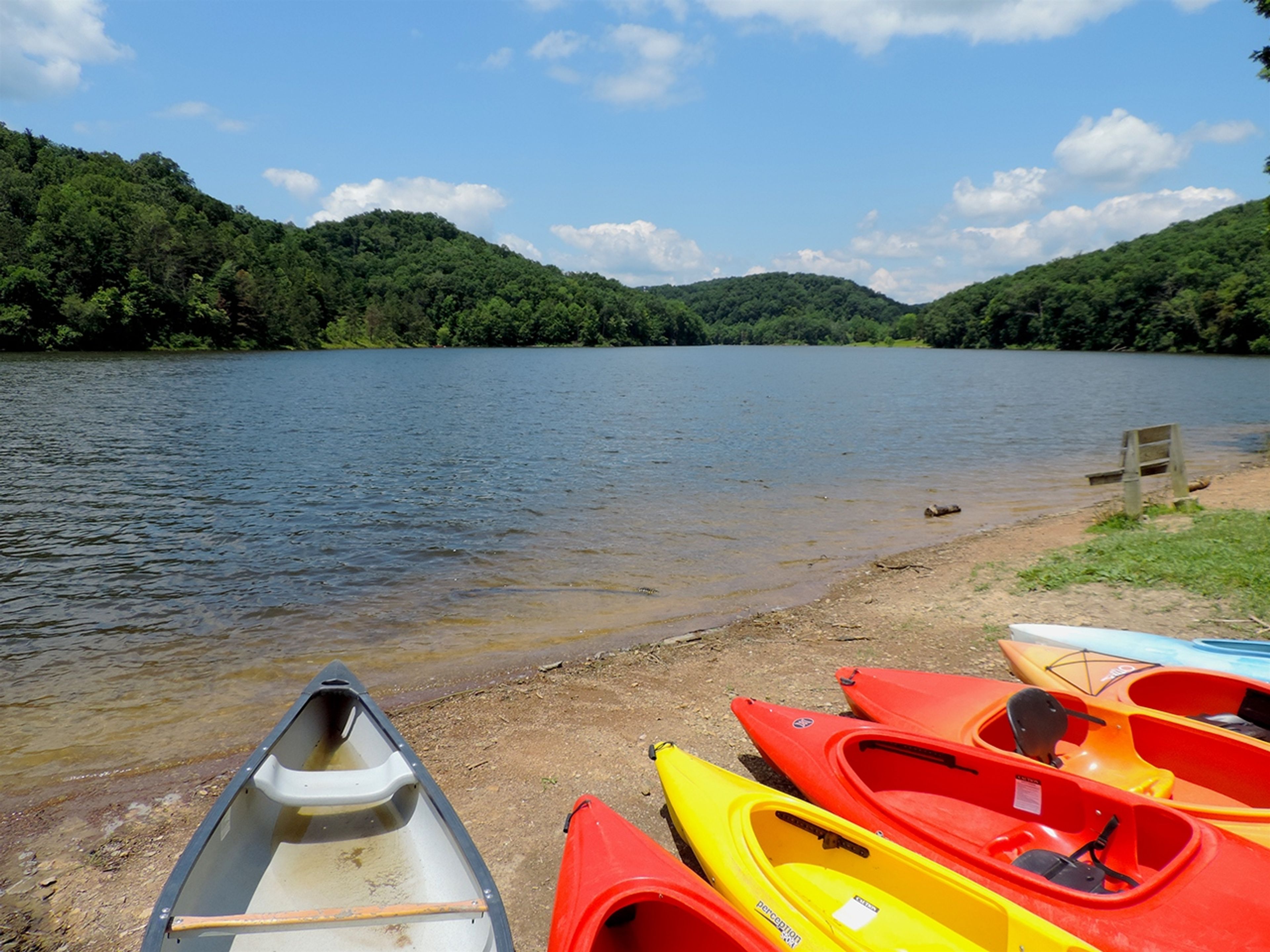 A group of kayaks on a beach at Shawnee State Park