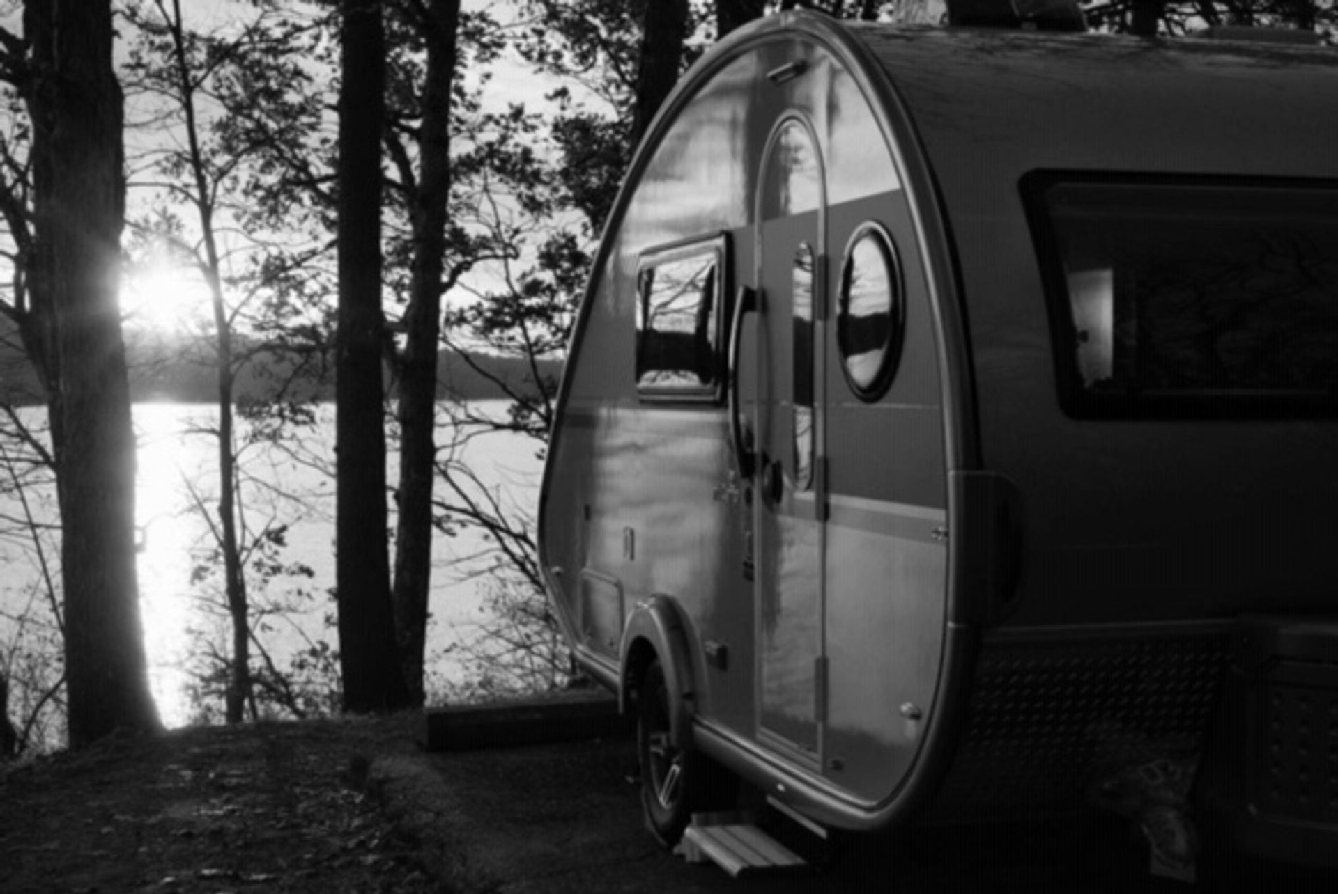 Trailer parked near a body of water at West Branch State Park